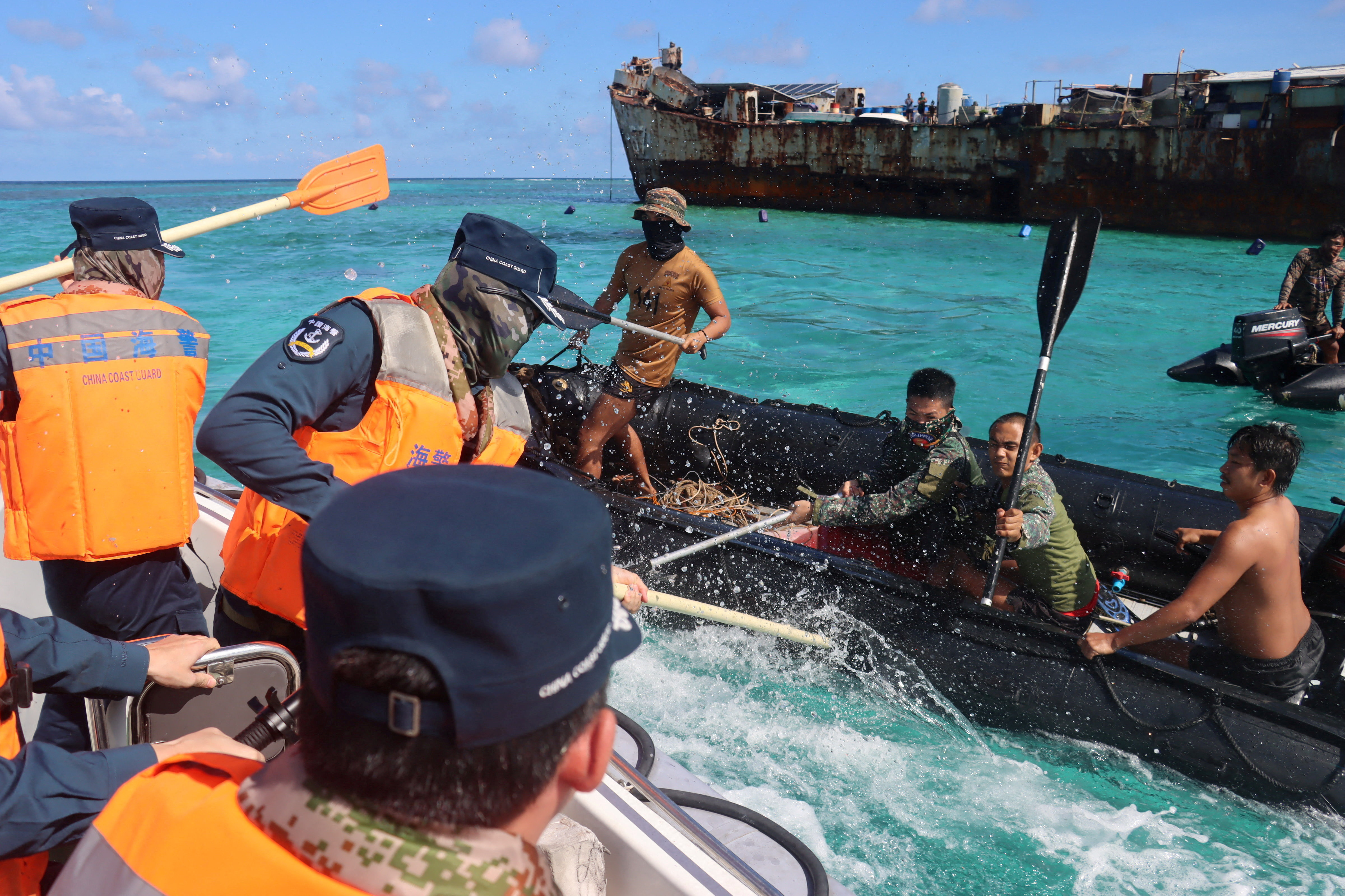 Philippine Navy personnel and China Coast Guard personnel clash near a grounded Philippine warship at Second Thomas Shoal, in the South China Sea, July 20, 2026. cnsphoto via REUTERS ATTENTION EDITORS - THIS IMAGE WAS PROVIDED BY A THIRD PARTY. CHINA OUT. TPX IMAGES OF THE DAY