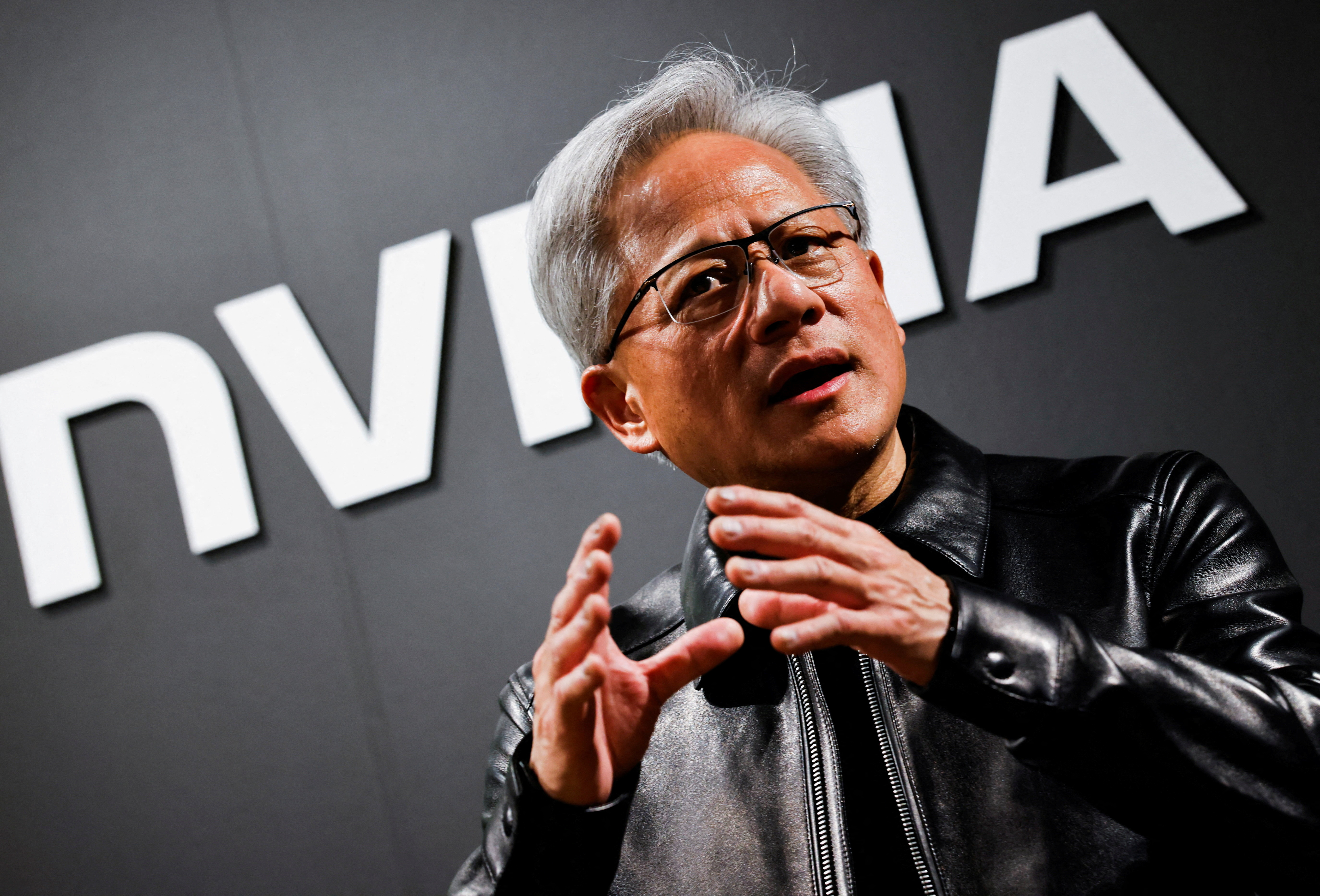 FILE PHOTO: Nvidia CEO Jensen Huang speaks during a doorstep after attending the AI Ecosystem Reception in Tokyo, Japan, July 16, 2026. REUTERS/Manami Yamada/File Photo