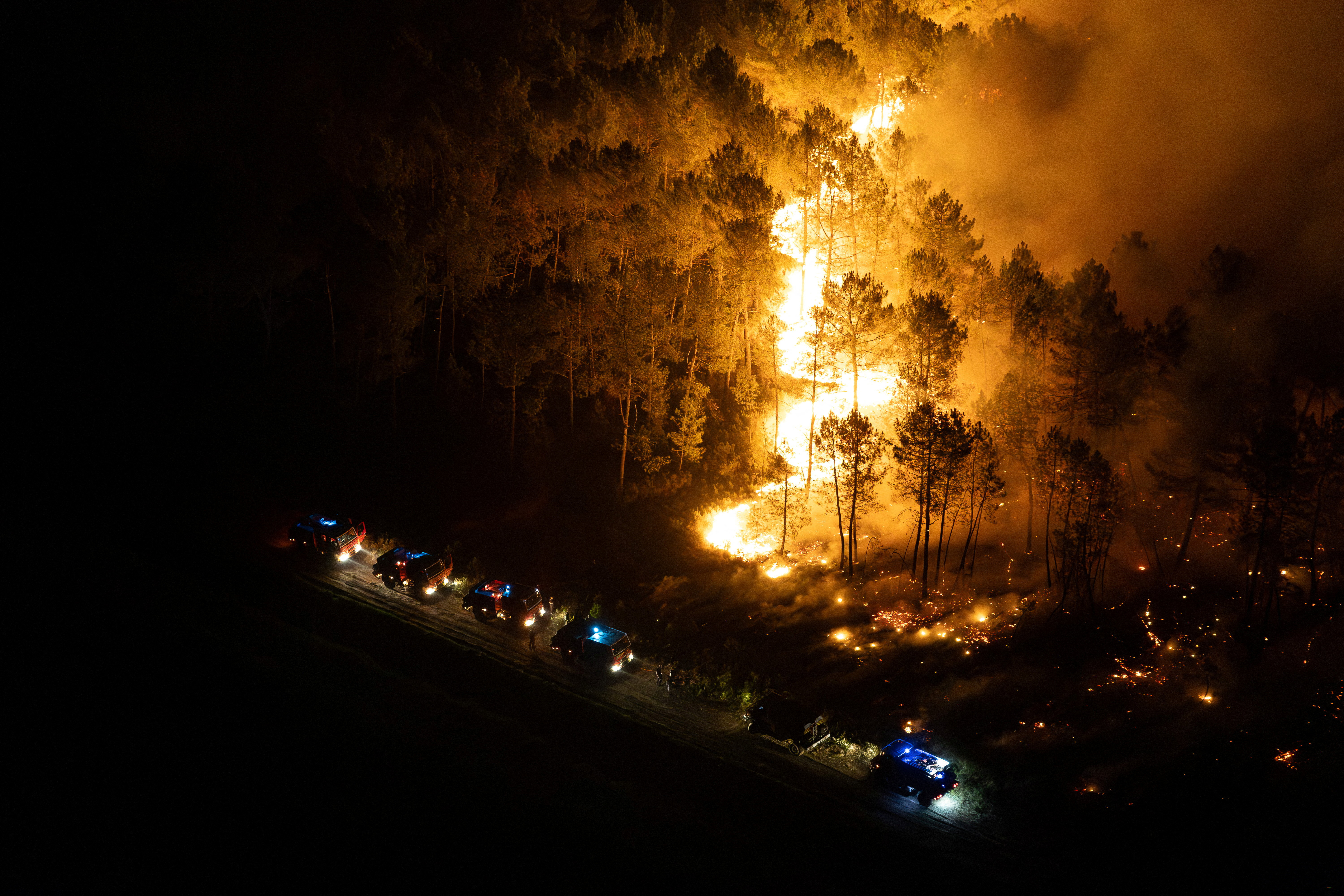 An aerial view of emergency vehicles near a wildfire in Lege-Cap-Ferret in the Gironde region in France