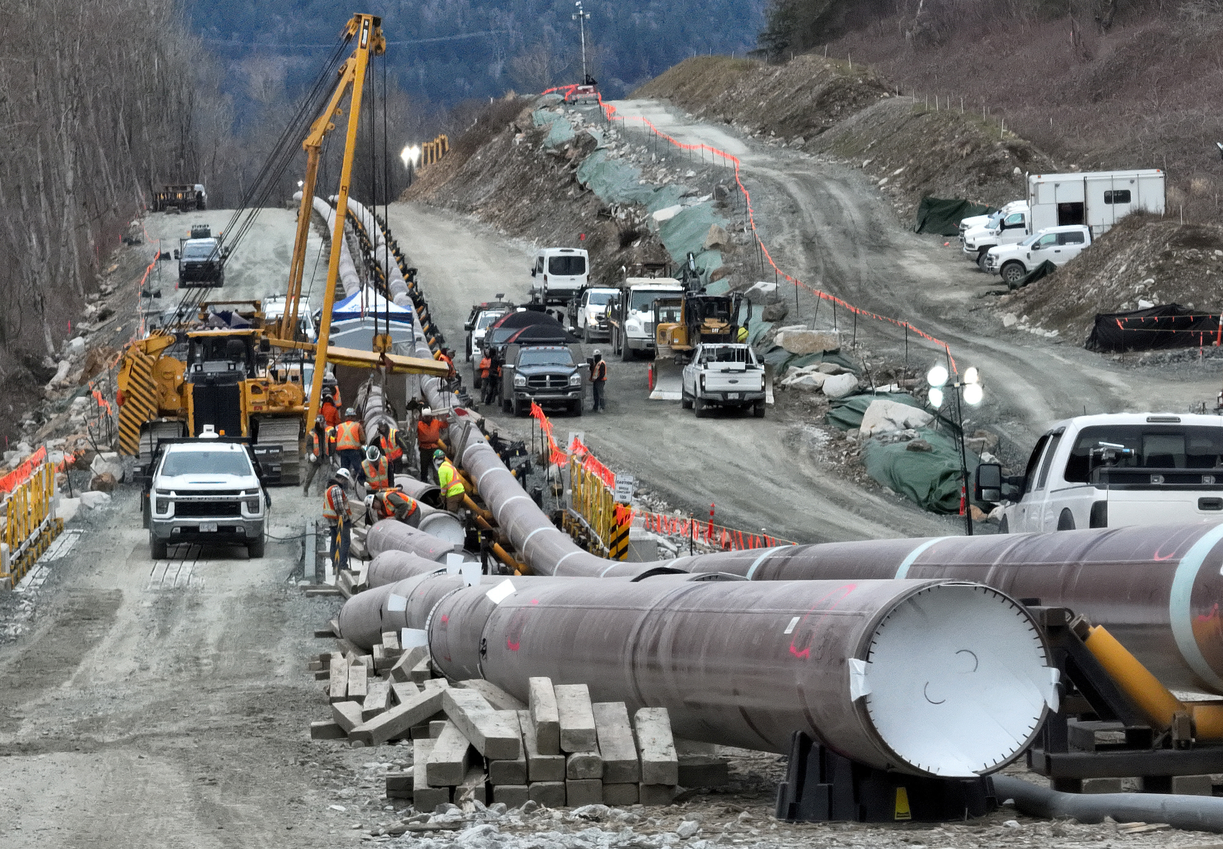 FILE PHOTO: The last section of pipeline is assembled on the Trans Mountain pipeline expansion project before operations are expected to begin in the second quarter of 2024, near Laidlaw, British Columbia, Canada, February 18, 2024. REUTERS/Chris Helgren/File Photo