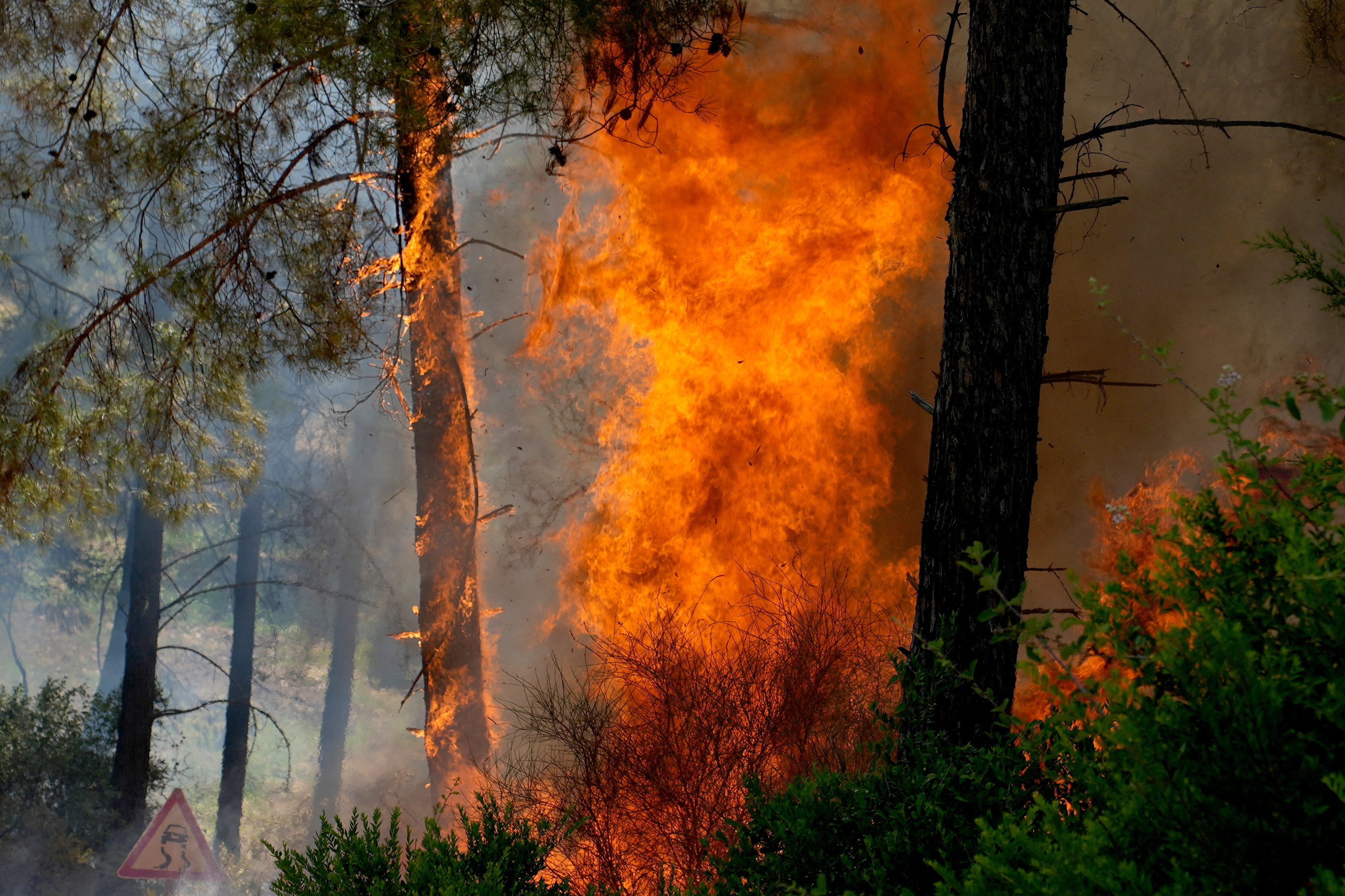 A wildfire burns in Seydikemer district of the southwestern Mugla province, Turkey, July 30, 2026. REUTERS/Ali Dinc