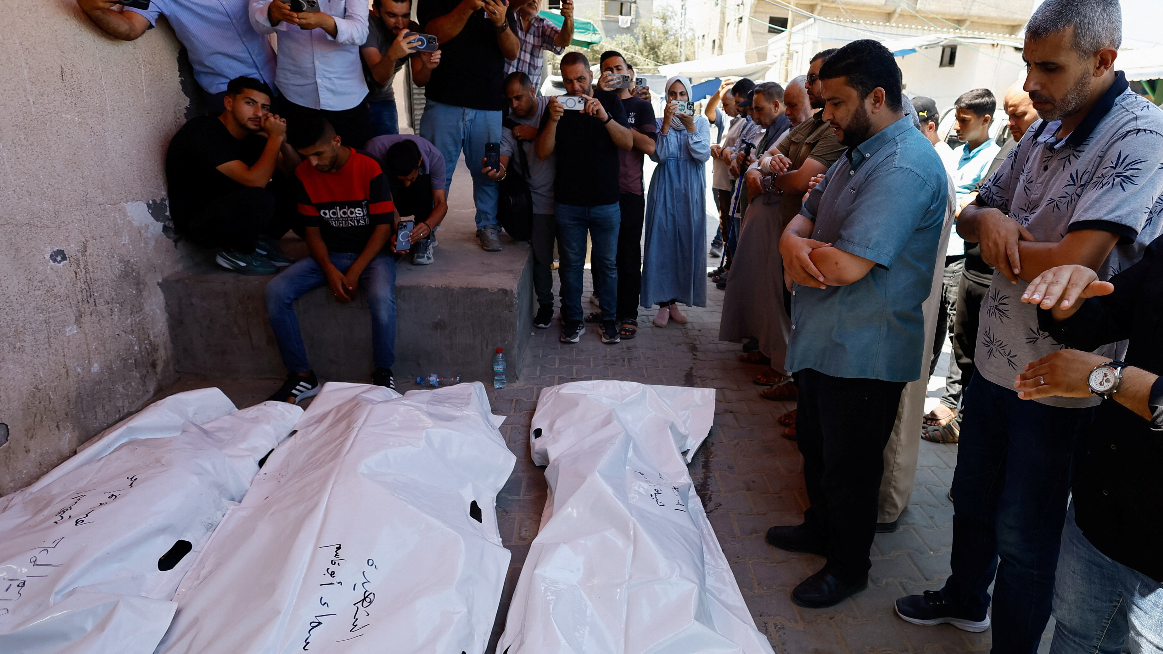 Palestinians held a funeral for a father, a mother and their six-year-old daughter killed in an Israeli air attack on an apartment building in Gaza’s Deir el-Balah. Health officials say the couple’s son was the only survivor of the attack.