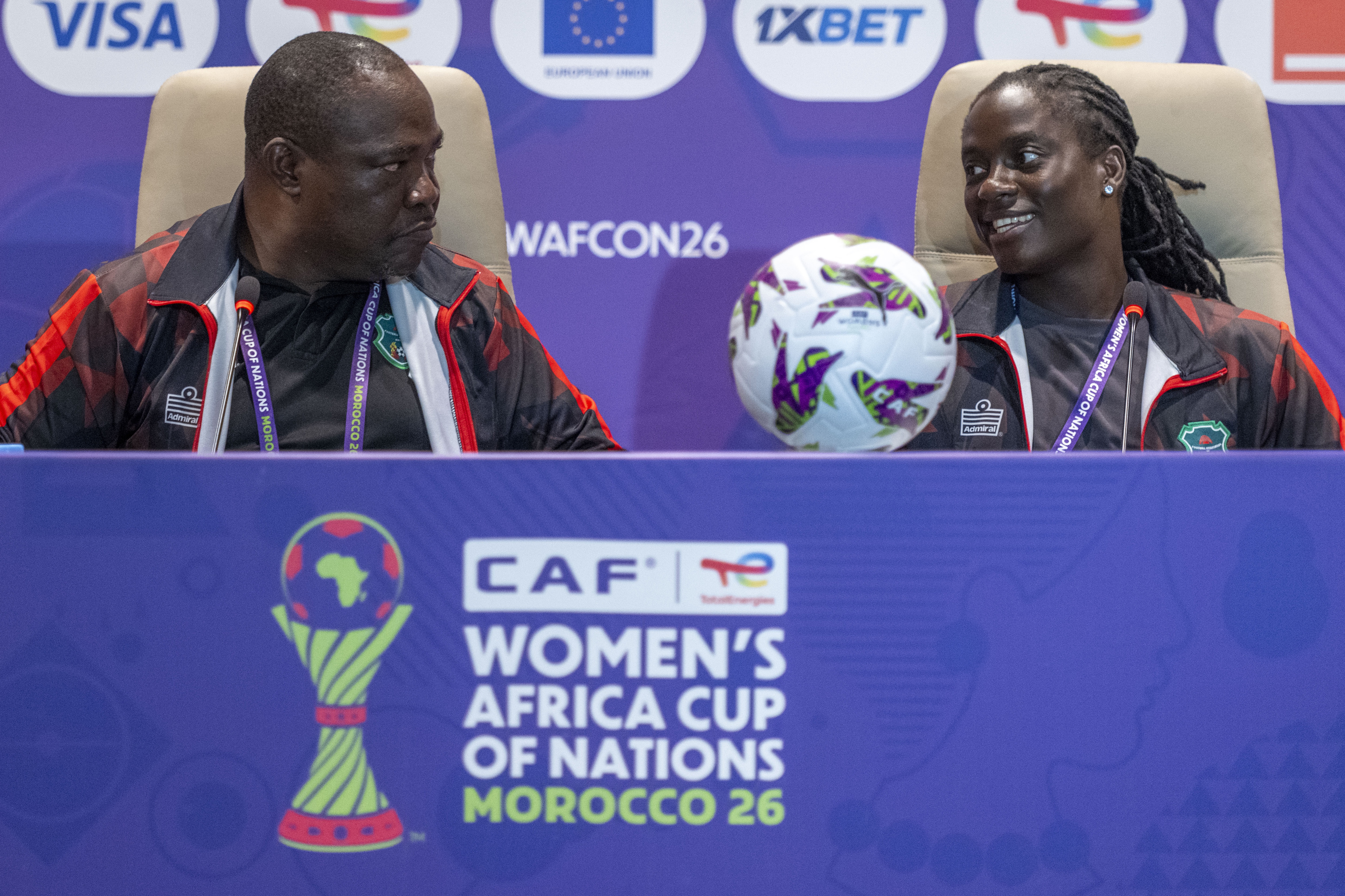 Lovemore Fazili (L), head coach of the Malawi women's national football team, and his player Tabita Chawinga attend a news conference.