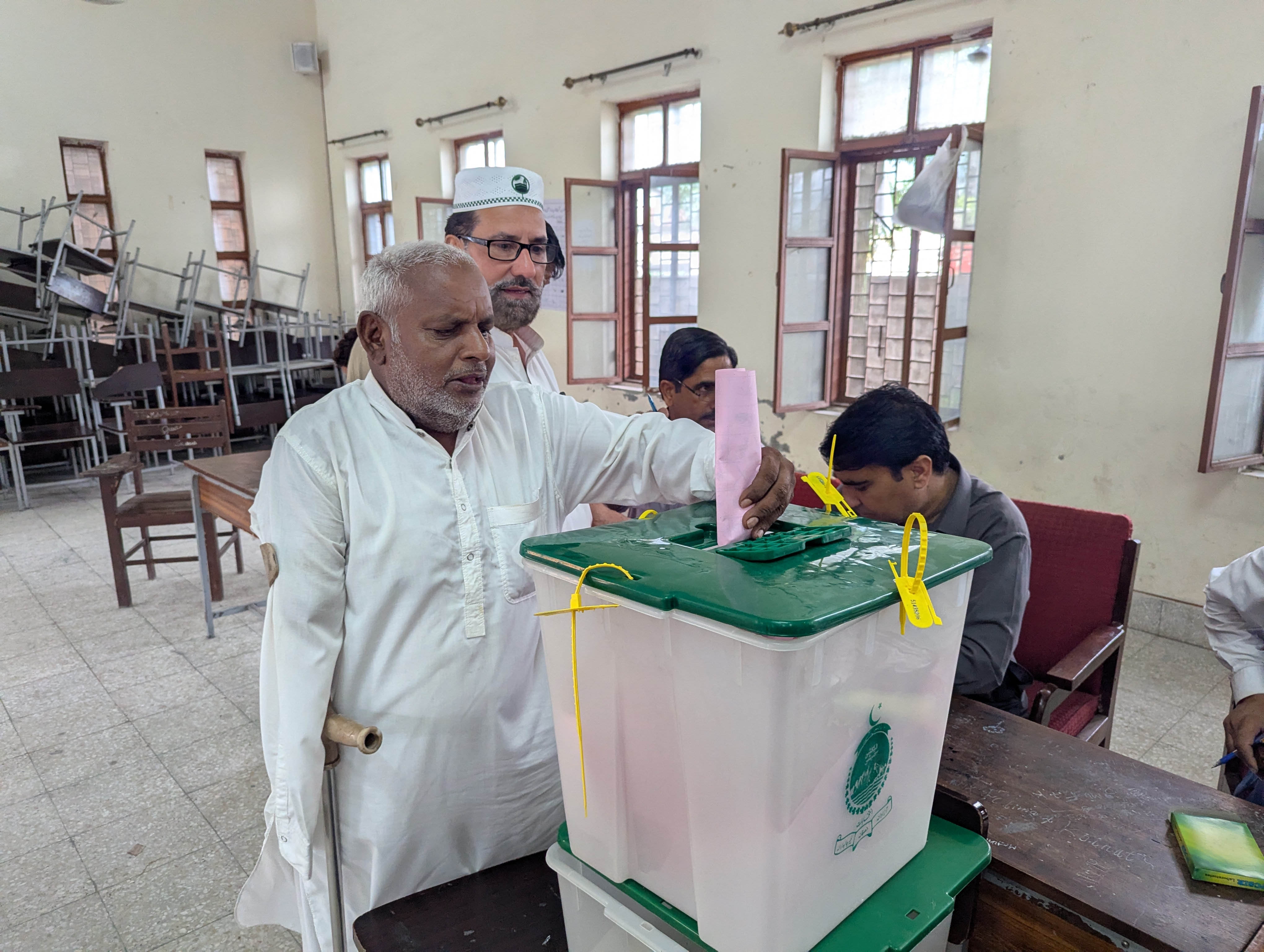 epa13146787 A man casts his ballot at a polling station during the second phase of elections for the local legislative assembly in Muzaffarabad, Pakistan-administered Kashmir, 02 August 2026. Polling took place under heightened security amid a boycott and protests by the banned Jammu Kashmir Awami Joint Action Committee (JAAC) over governance issues and the allocation of refugee seats in the regional assembly. EPA/AMIRUDDIN MUGHAL
