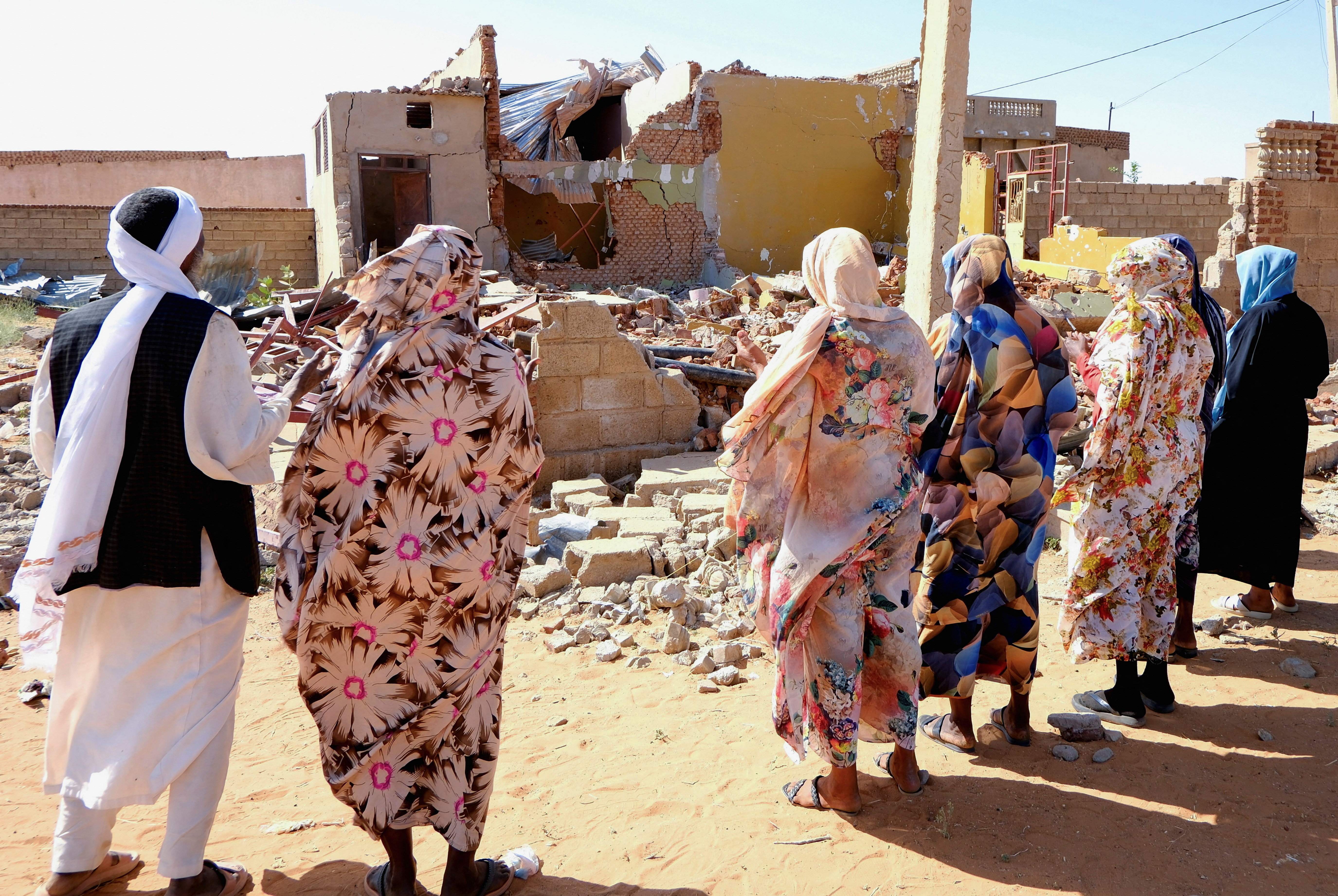 People pray for the victims of a drone strike in El Obeid, North Kordofan State, Sudan, January 12, 2026. REUTERS/El Tayeb Siddig