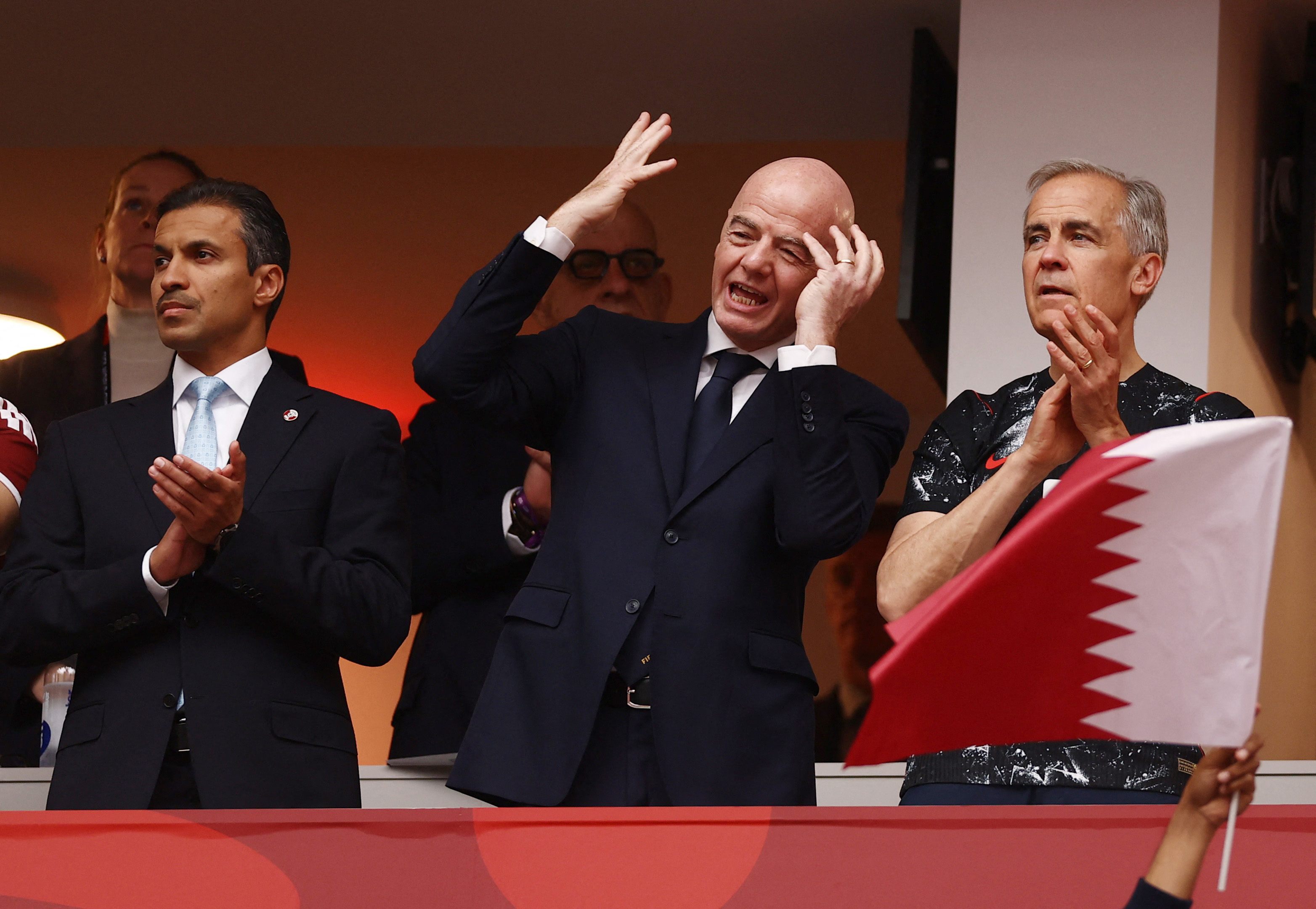 Canadian Prime Minister Mark Carney next to FIFA President Giovanni Infantino and President of the Qatar Stars League H.E. Jassim bin Rashid Al Buenain inside the stadium before the match