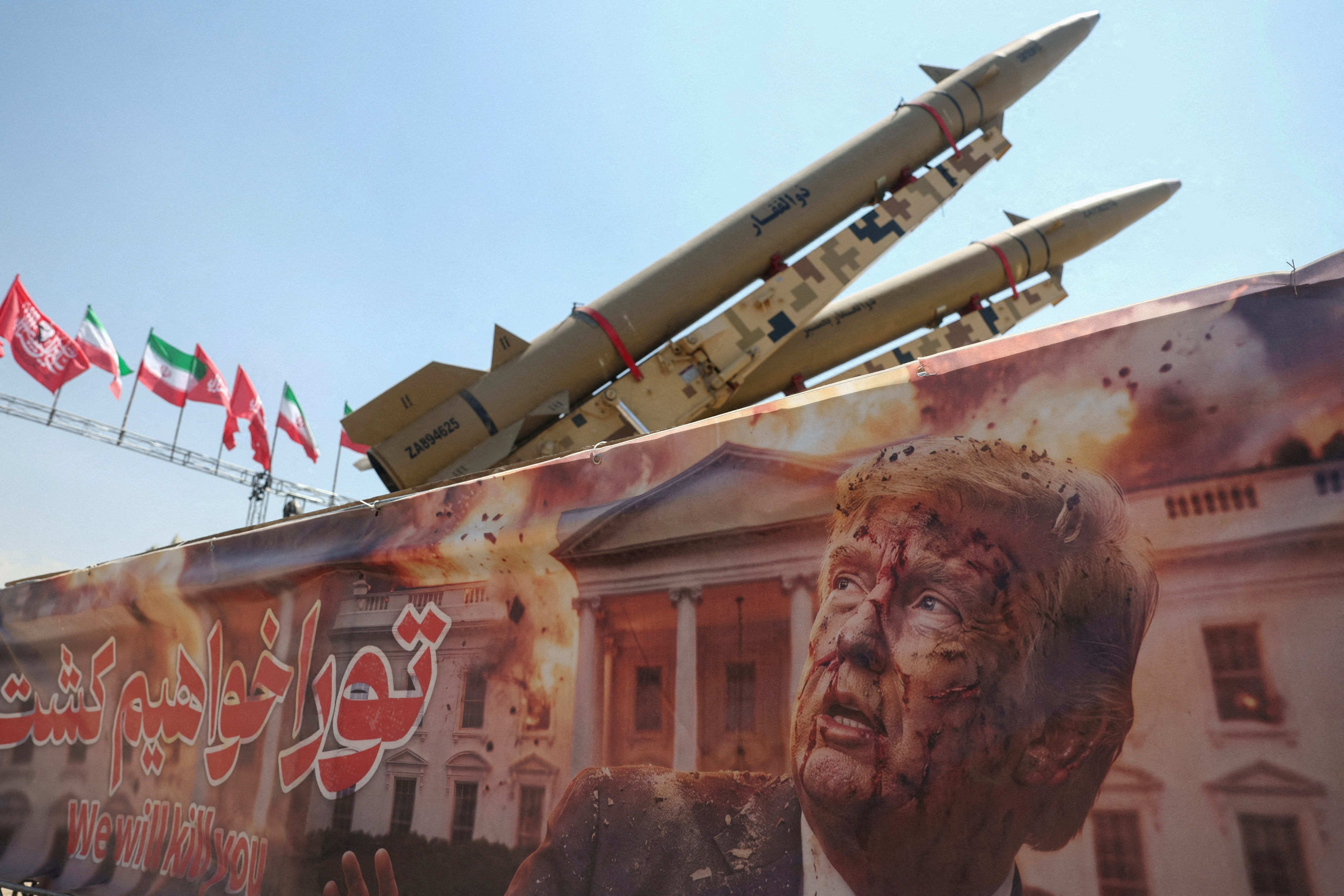 A banner with a picture of U.S. President Donald Trump next to an Iranian missile system at Azadi Square in Tehran, Iran, July 30, 2026. Majid Asgaripour/WANA (West Asia News Agency) via REUTERS ATTENTION EDITORS - THIS PICTURE WAS PROVIDED BY A THIRD PARTY. ISRAEL OUT. NO COMMERCIAL OR EDITORIAL SALES IN ISRAEL. NO ACCESS FOR ISRAELI MEDIA. NO USE BBC PERSIAN. NO USE VOA PERSIAN. NO USE MANOTO. NO USE IRAN INTERNATIONAL. NO USE RADIO FARDA. DIGITAL: NO USE BBC PERSIAN. NO USE VOA PERSIAN. NO USE MANOTO. NO USE IRAN INTERNATIONAL. NO USE RADIO FARDA. TPX IMAGES OF THE DAY