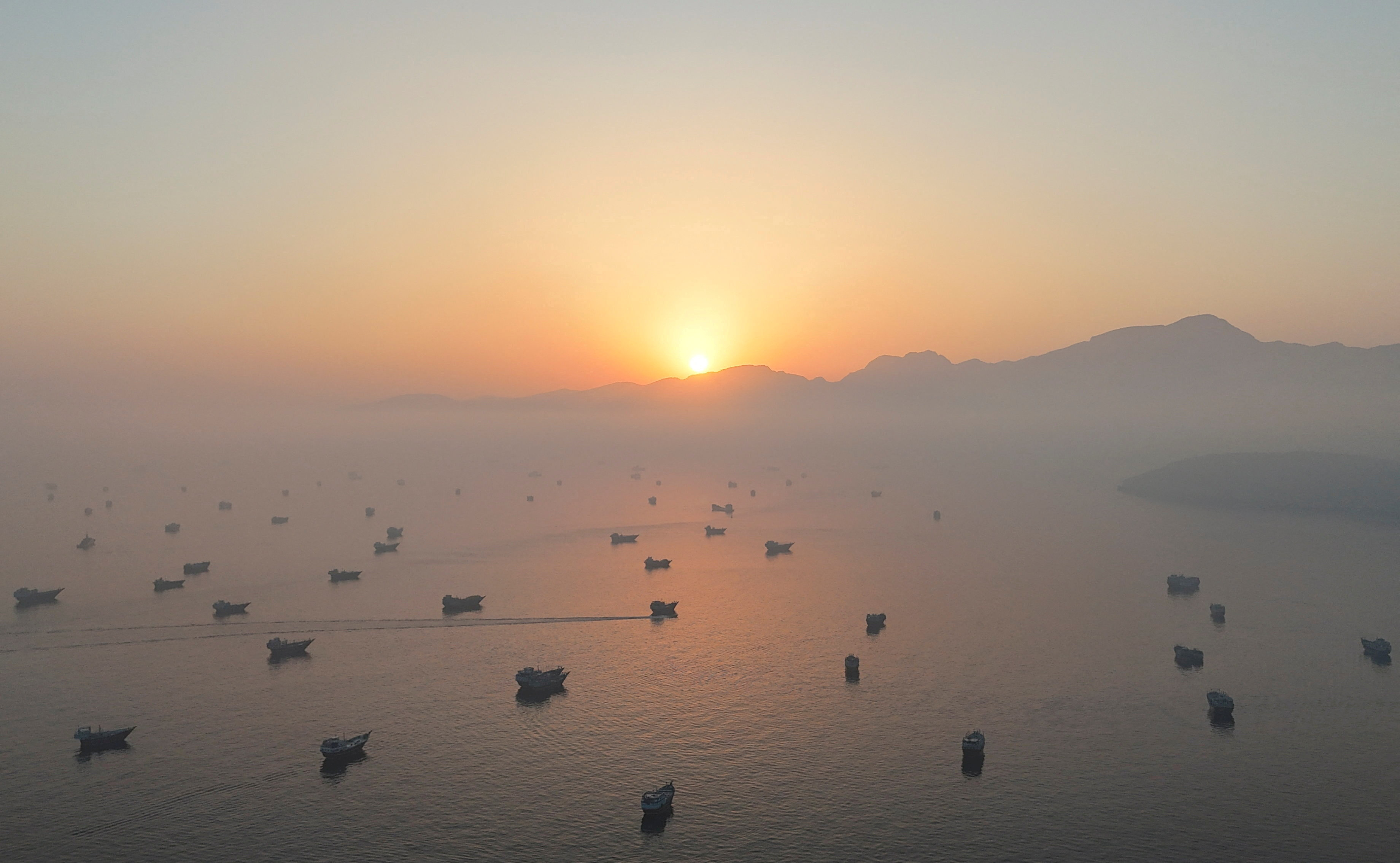FILE PHOTO: A drone view shows vessels in the Strait of Hormuz, as seen from Musandam, Oman, June 15, 2026. REUTERS/Stringer/File Photo