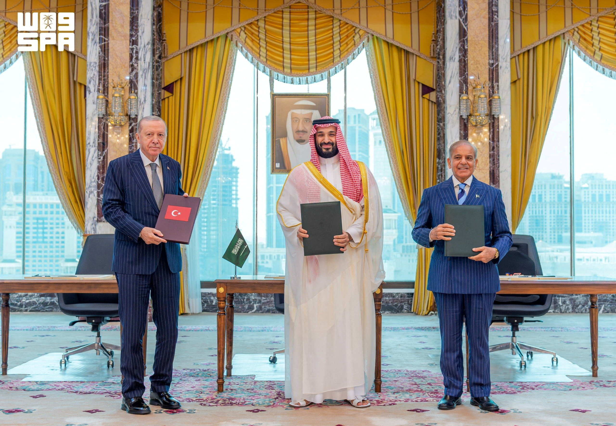 Turkish President Tayyip Erdogan, Saudi Crown Prince Mohammed bin Salman, and Pakistan's Prime Minister Shehbaz Sharif pose after signing a joint defence agreement in Mecca, Saudi Arabia, August 7, 2026. Saudi Press Agency/Handout via REUTERS ATTENTION EDITORS - THIS PICTURE WAS PROVIDED BY A THIRD PARTY. WATERMARK FROM SOURCE TPX IMAGES OF THE DAY