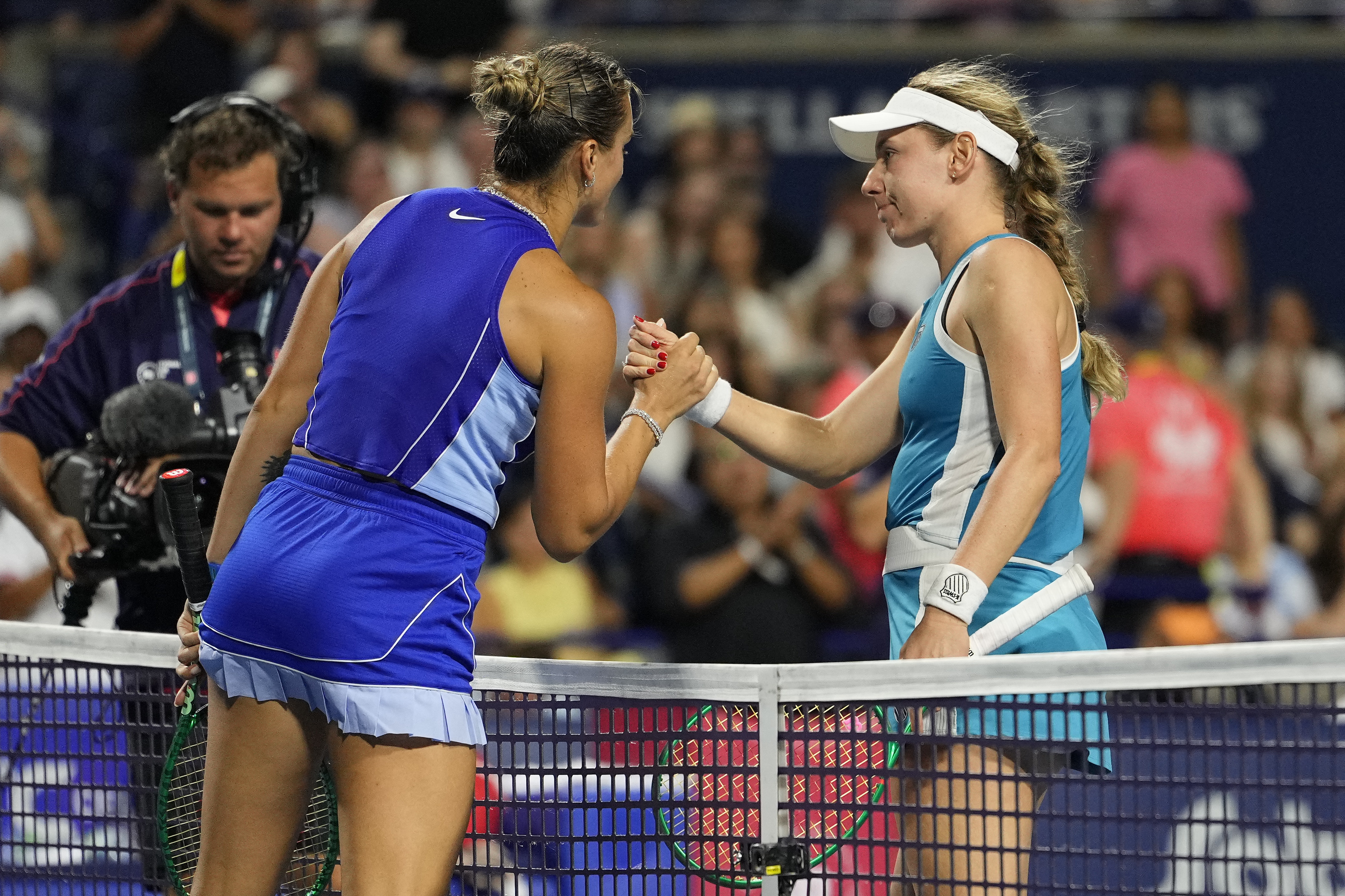 Aryna Sabalenka congratulates Ekaterina Alexandrova, right, on her fourth-round victory at the Canadian Open, August 8, 2026