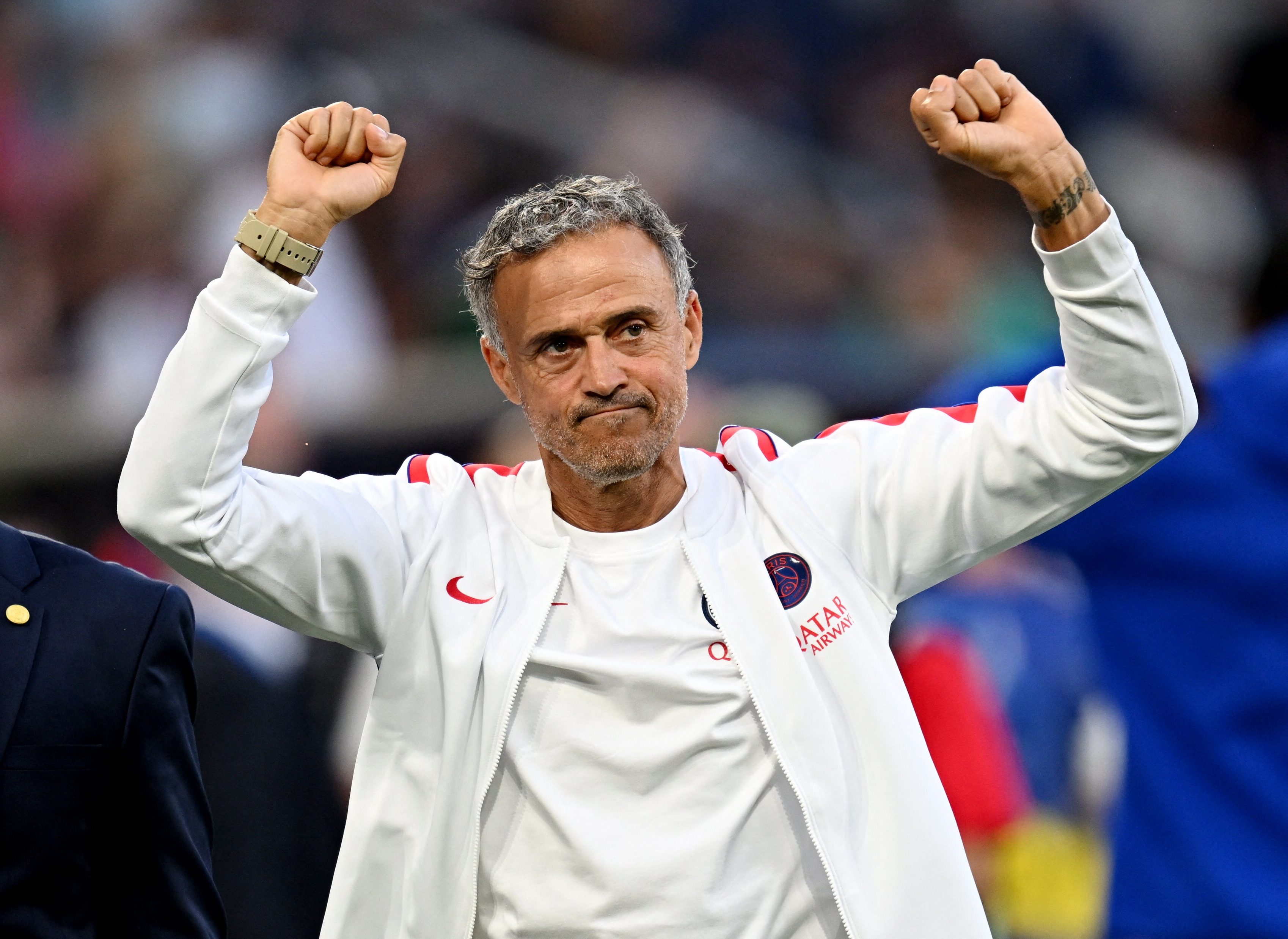 Paris St Germain coach Luis Enrique waves inside the stadium before the match