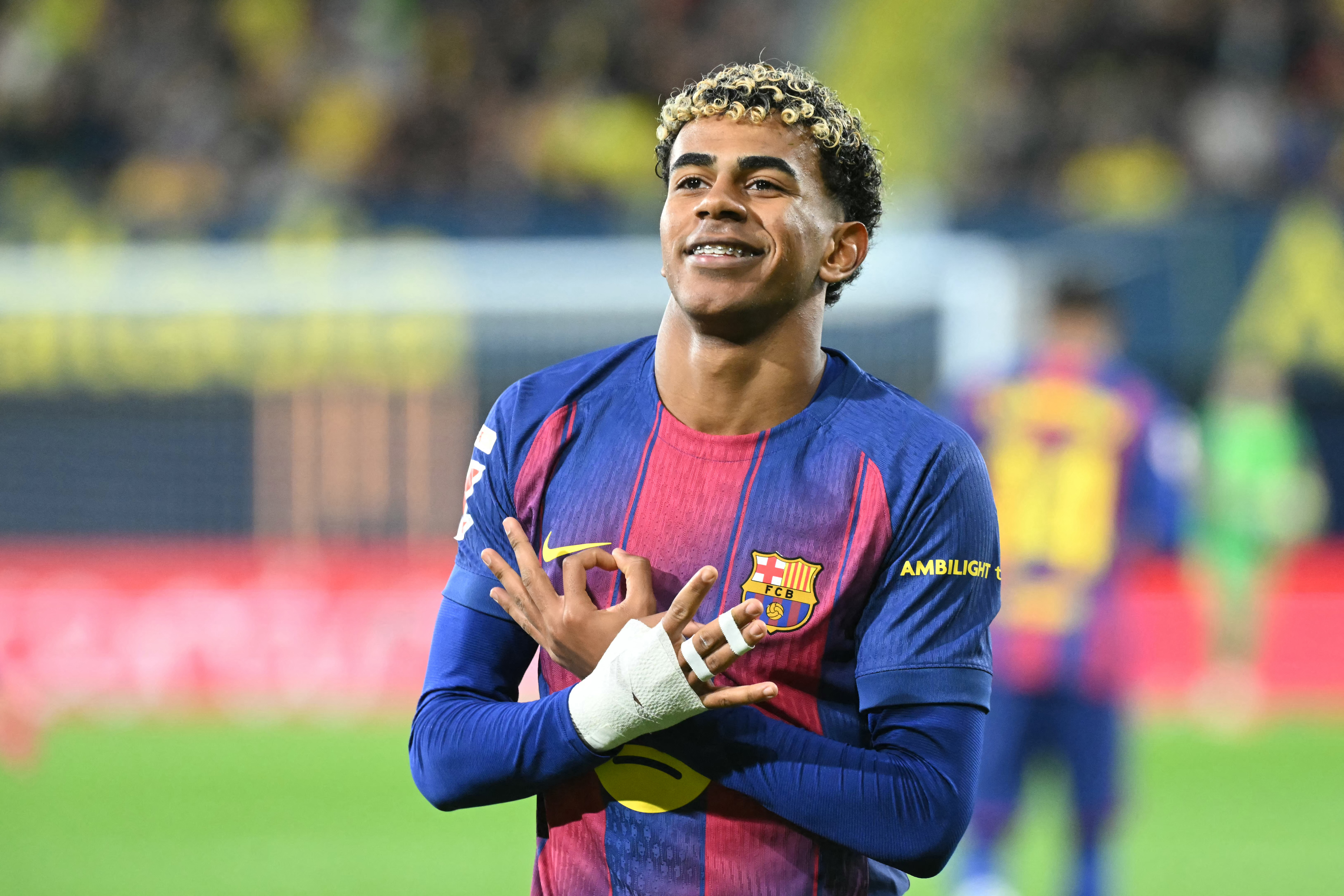 A football player celebrates on the pitch