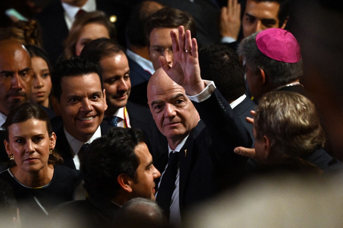 FIFA's president Gianni Infantino waves on arrival for the swearing-in ceremony of Colombia's new President Abelardo de la Espriella at Universidad Santiago de Cali in Cali, Colombia