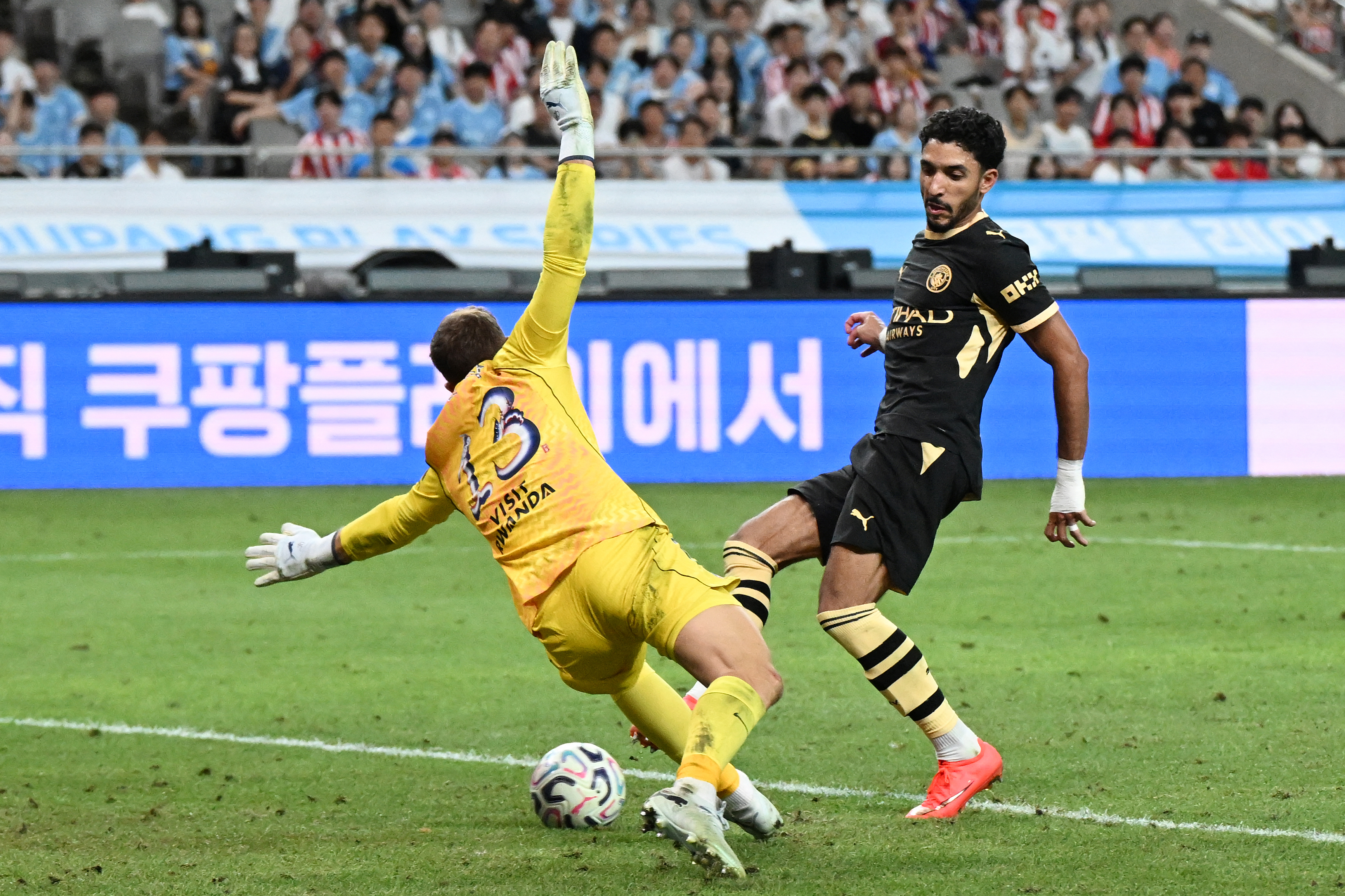 Omar Marmoush, right, scores his second goal past Atletico Madrid’s keeper Jan Oblak in the 59th minute