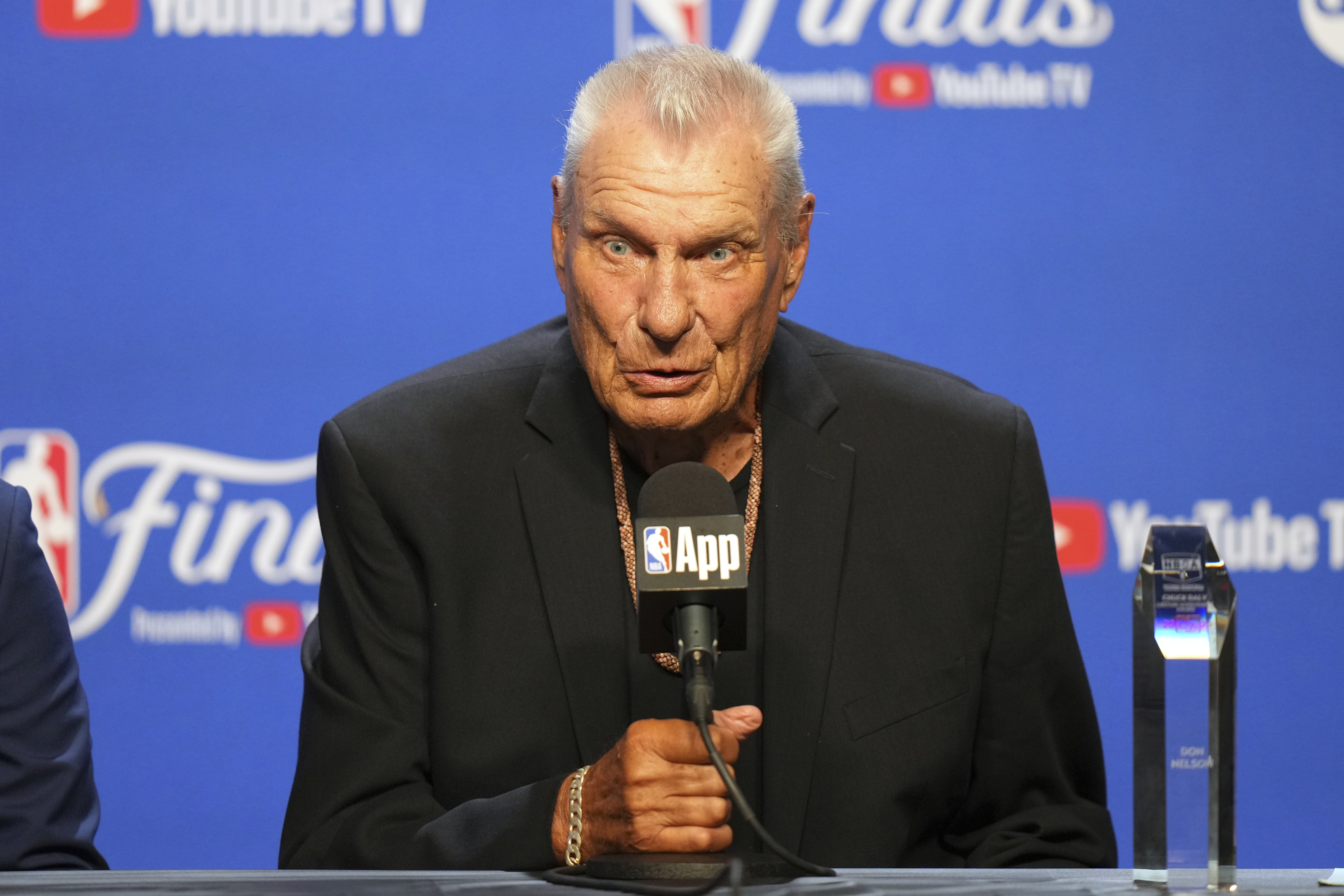 A man holds a microphone