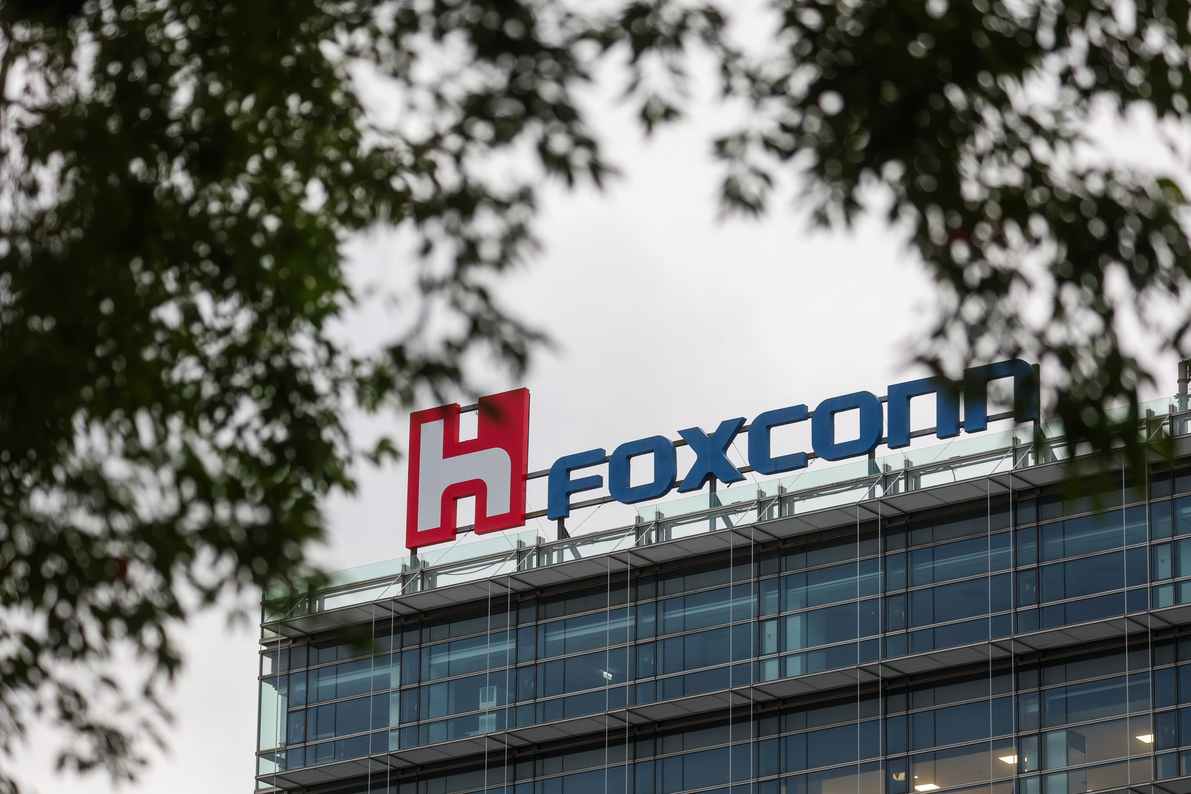 The top of a building with the company logo