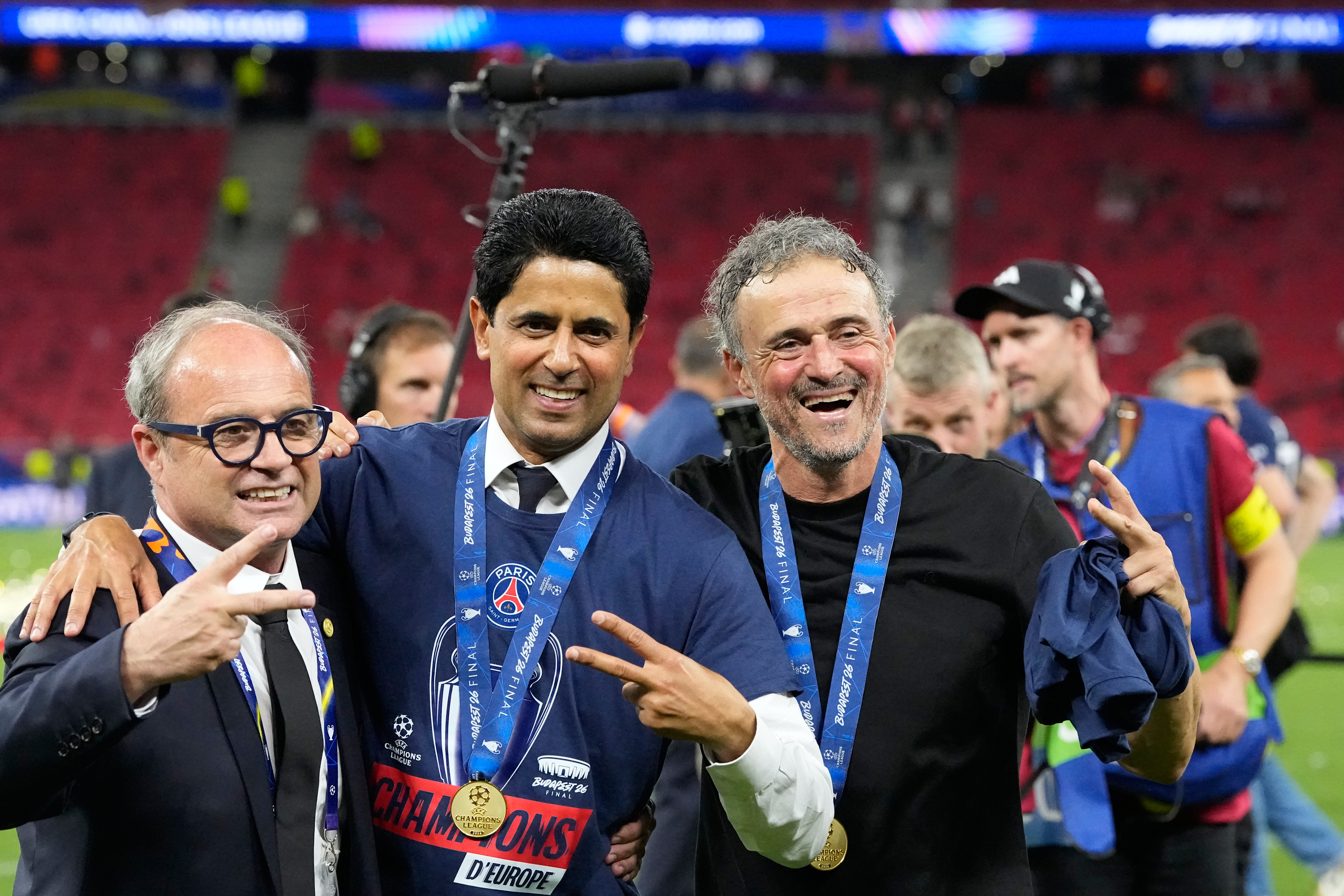 PSG's head coach Luis Enrique, from right, club President Nasser bin Ghanim Al-Khelaifi and sports director Luis Campos pose after winning the Champions League final soccer match between Paris Saint-Germain and Arsenal