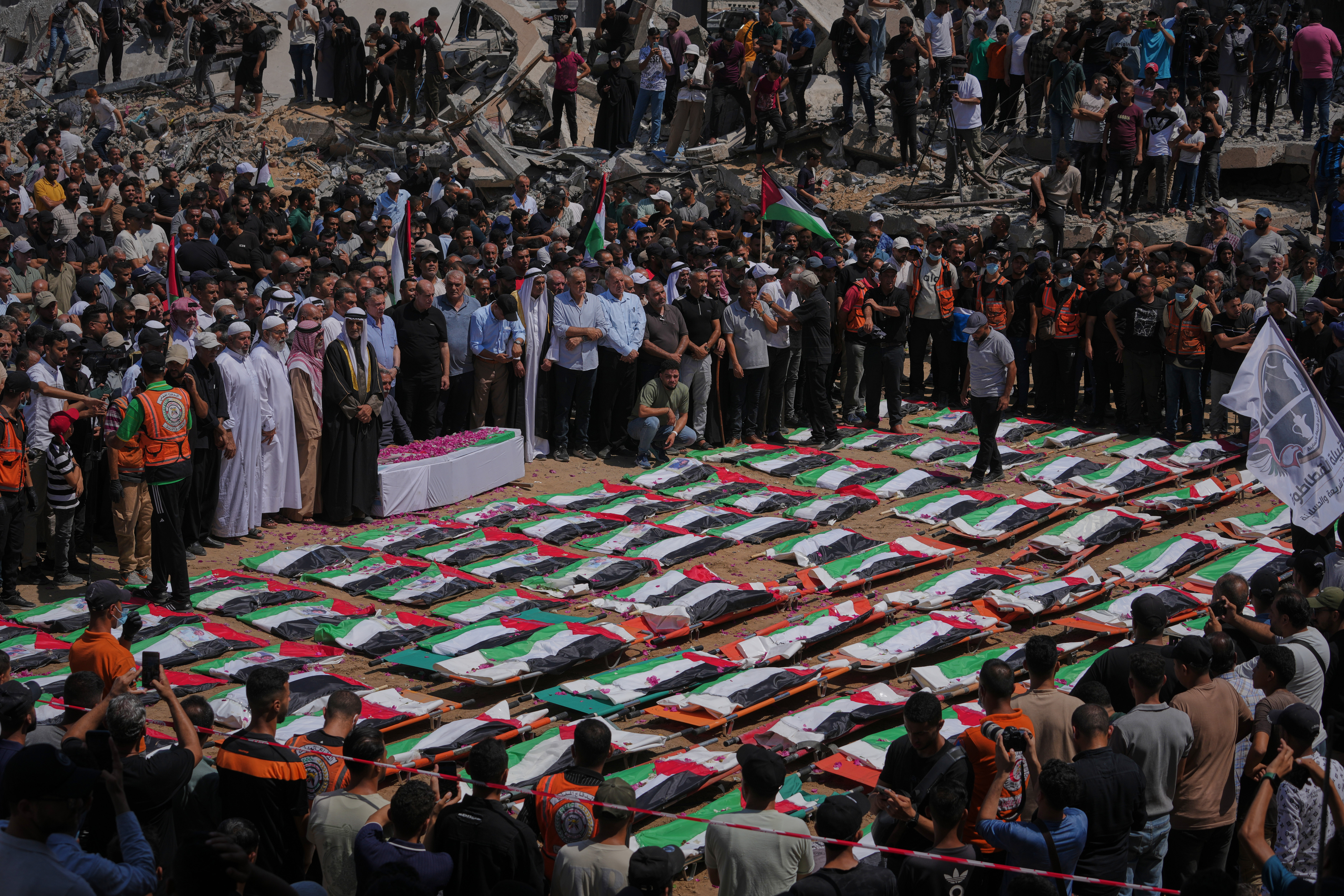 Thousands mourn 112 Palestinians at mass funeral in Gaza City