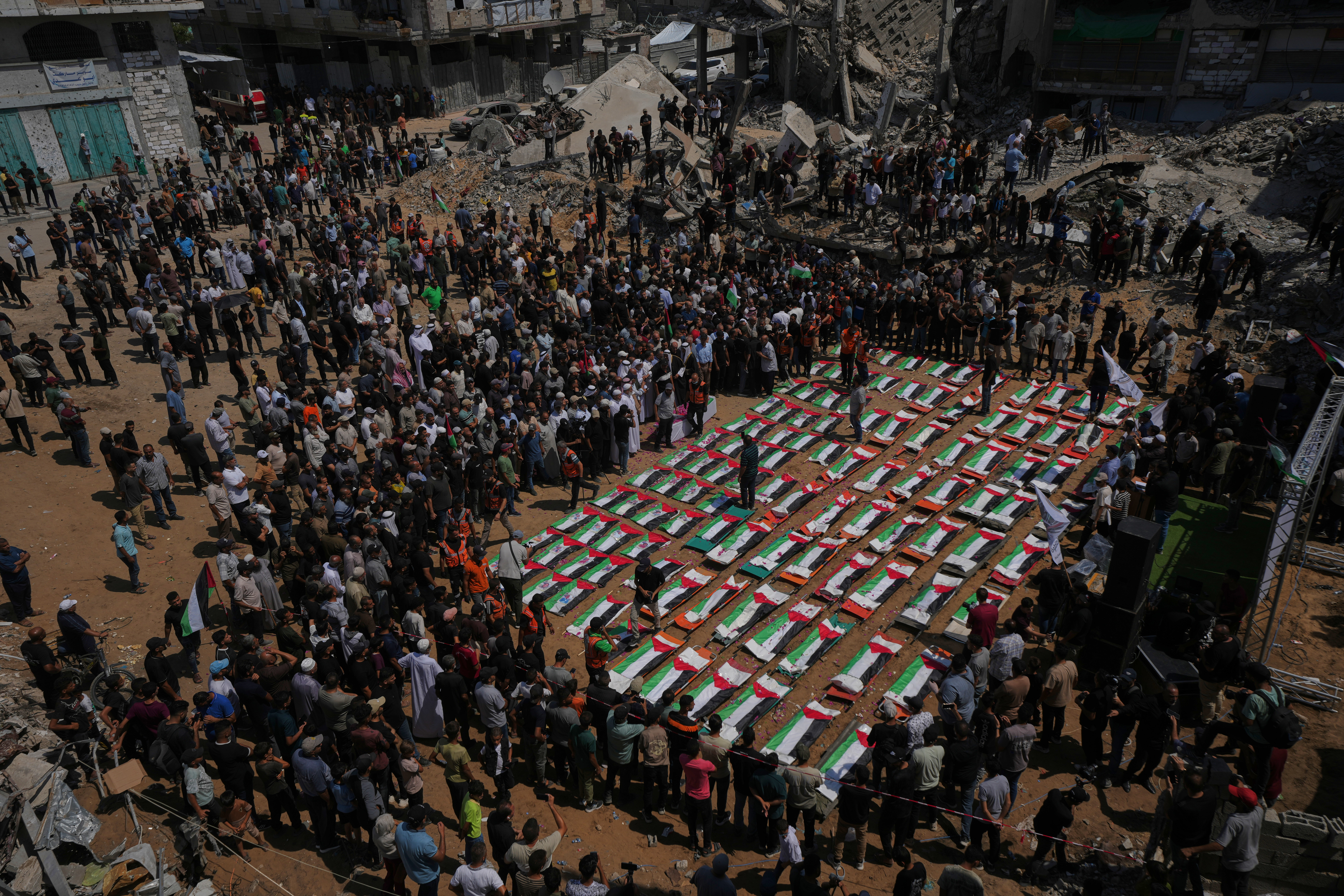Thousands mourn 112 Palestinians at mass funeral in Gaza City