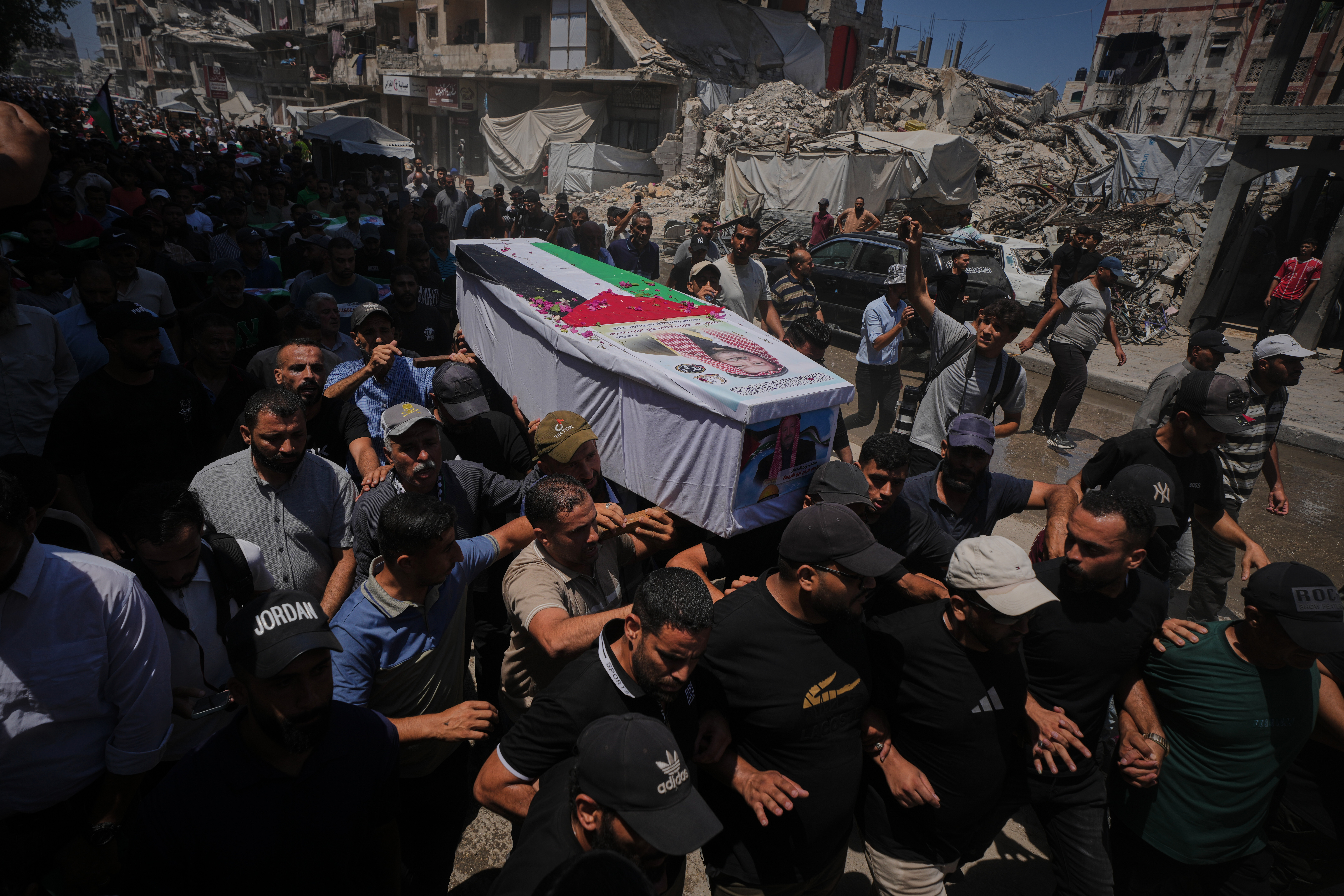 Thousands mourn 112 Palestinians at mass funeral in Gaza City