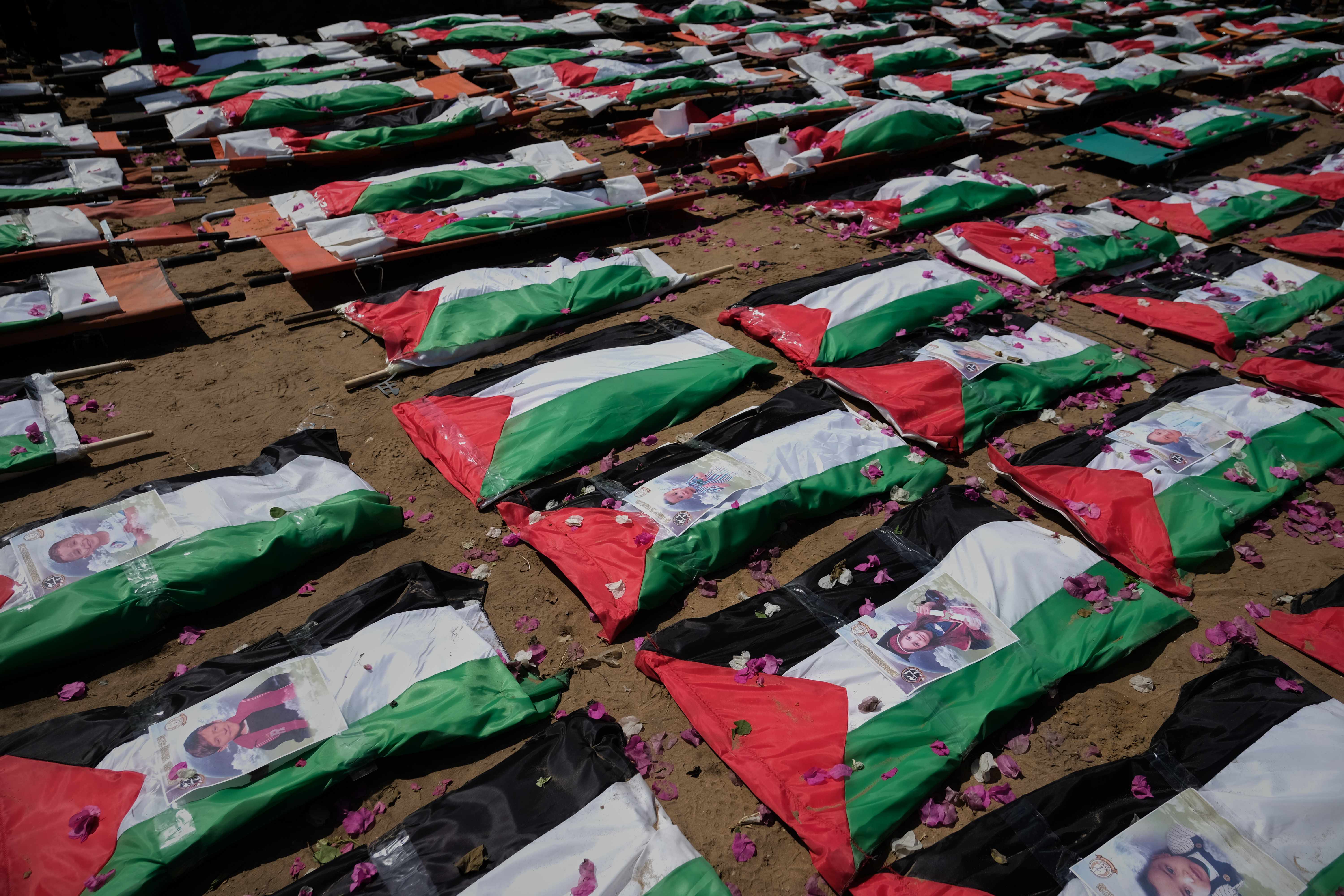 Thousands mourn 112 Palestinians at mass funeral in Gaza City