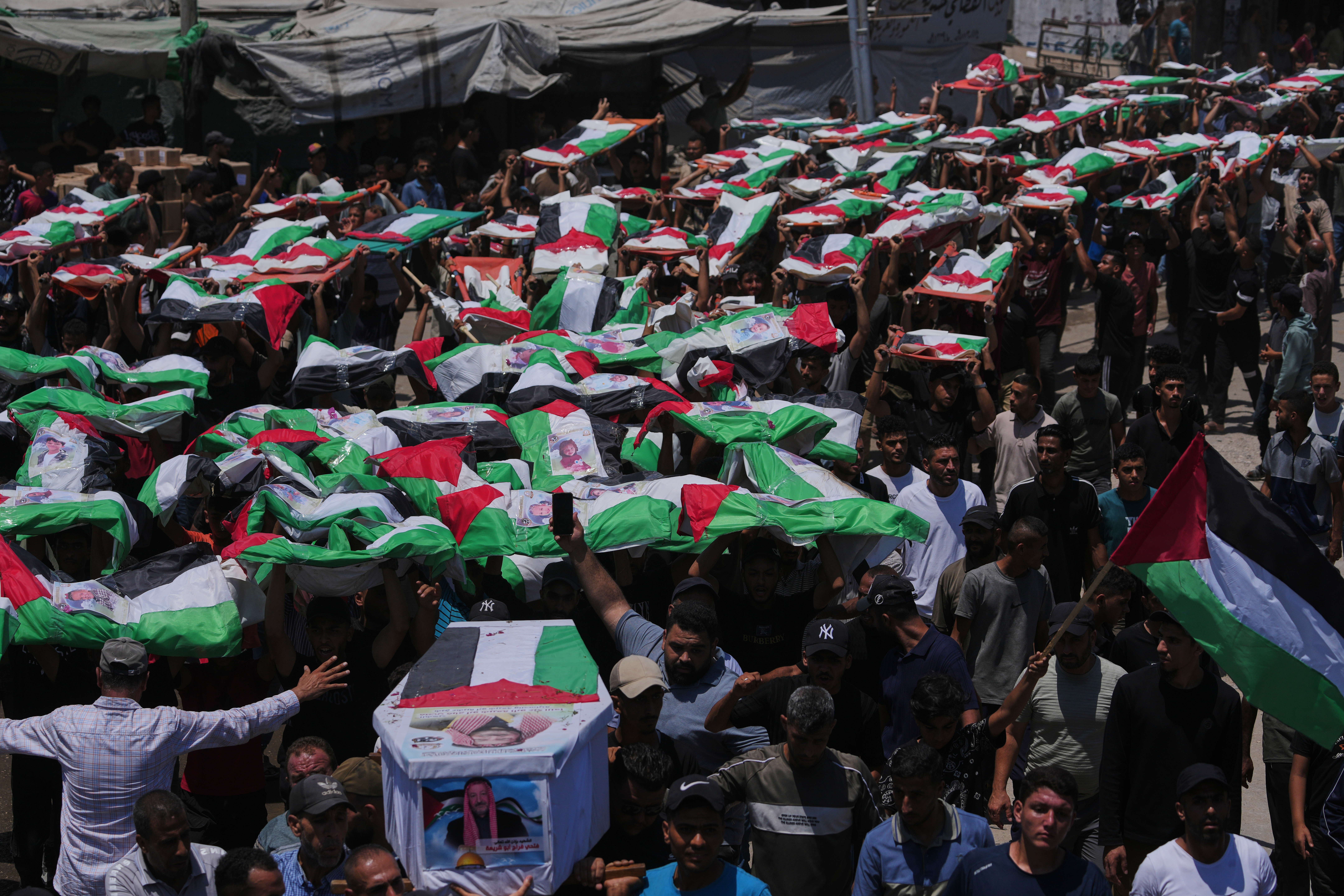 Thousands mourn 112 Palestinians at mass funeral in Gaza City