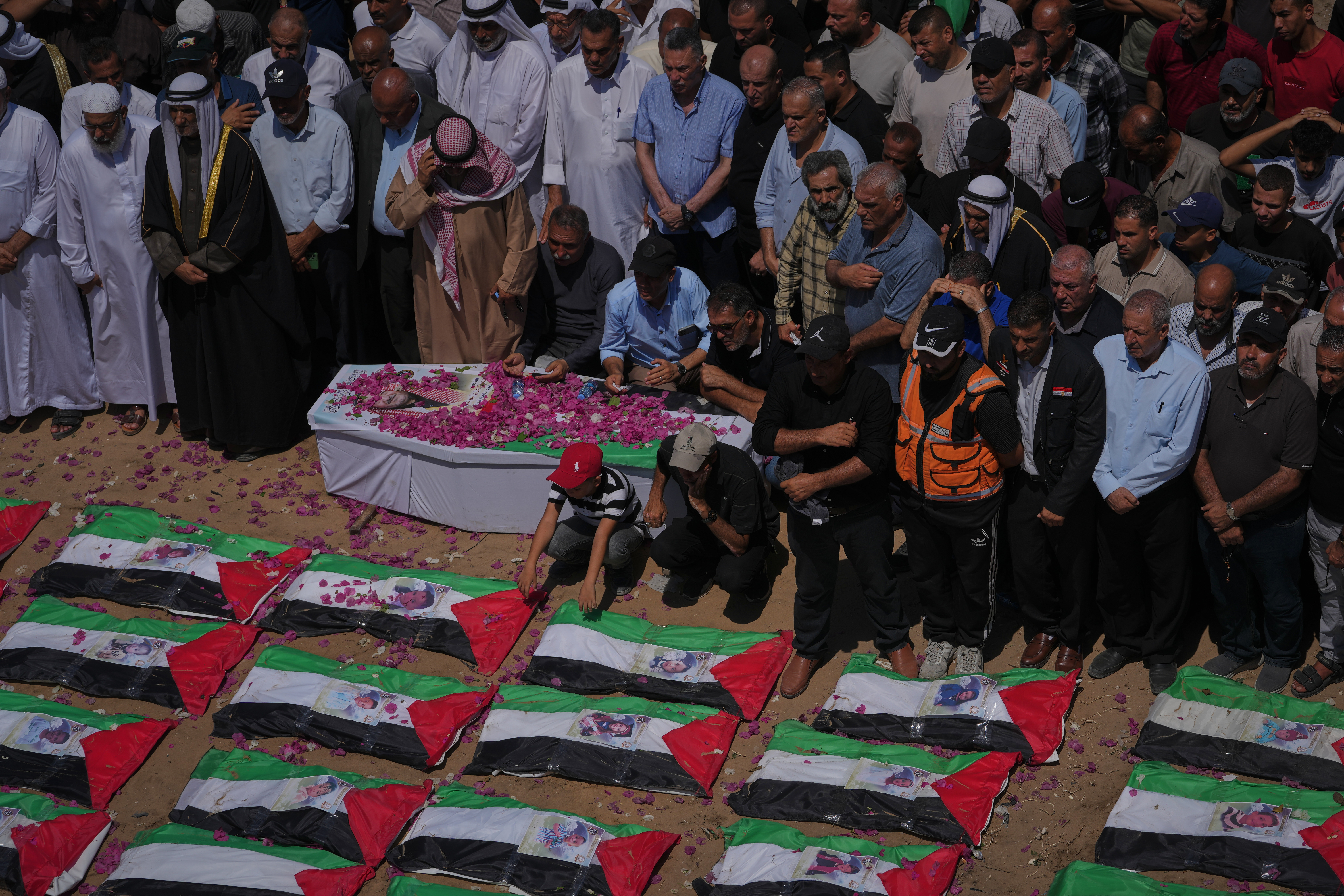 Thousands mourn 112 Palestinians at mass funeral in Gaza City