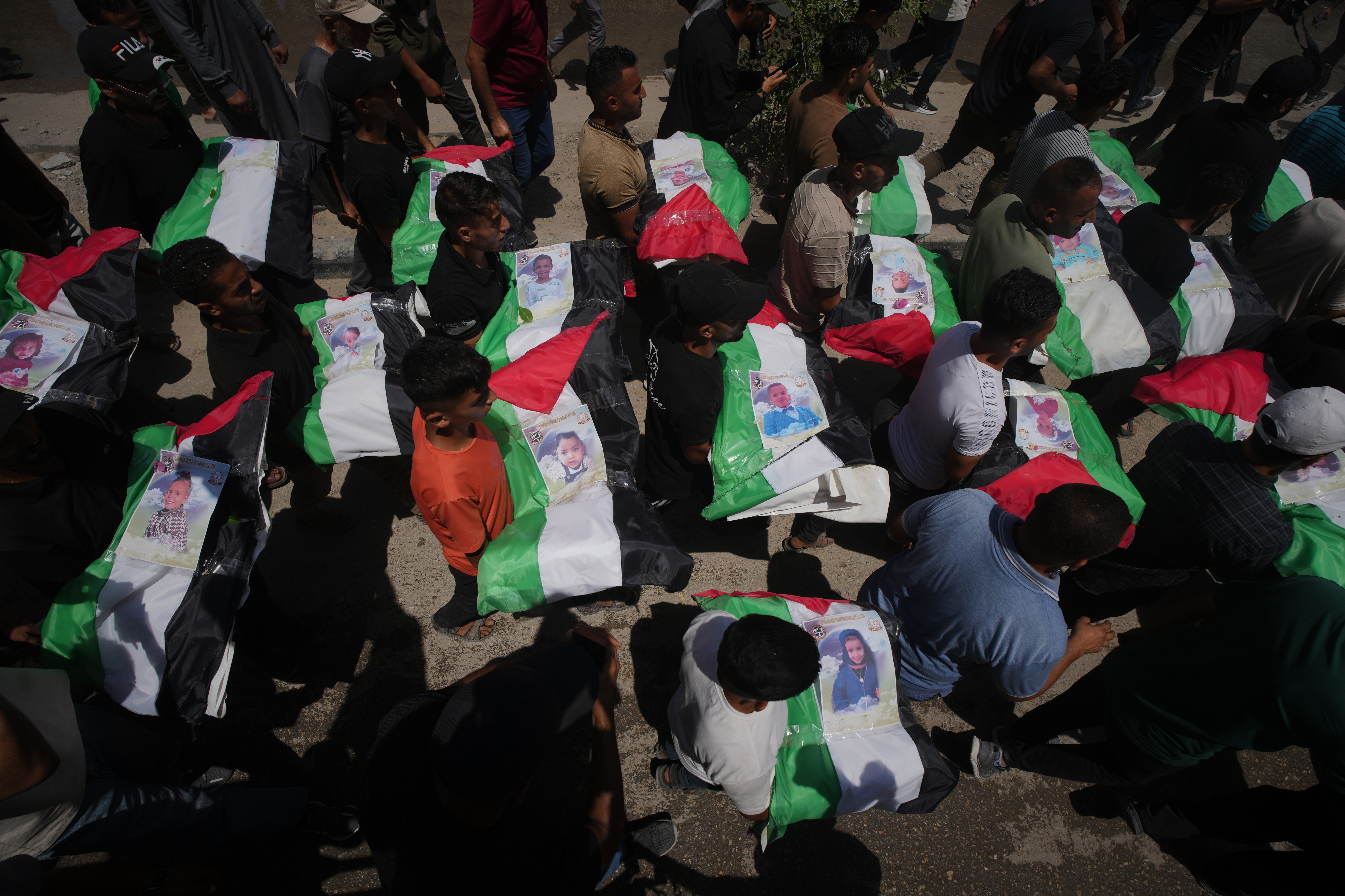 Thousands mourn 112 Palestinians at mass funeral in Gaza City