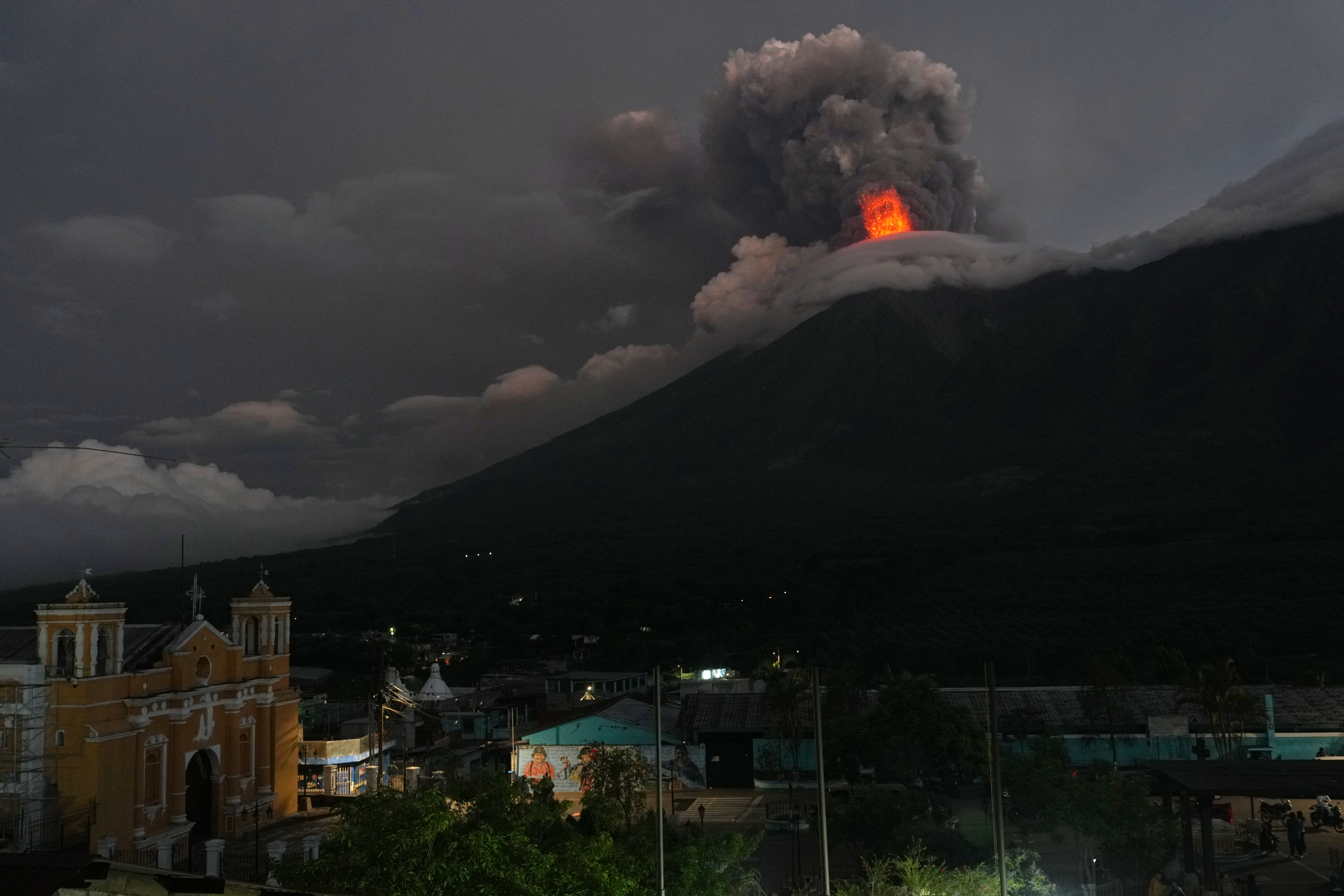 Lava flows out of the crater of the Fuego Volcano