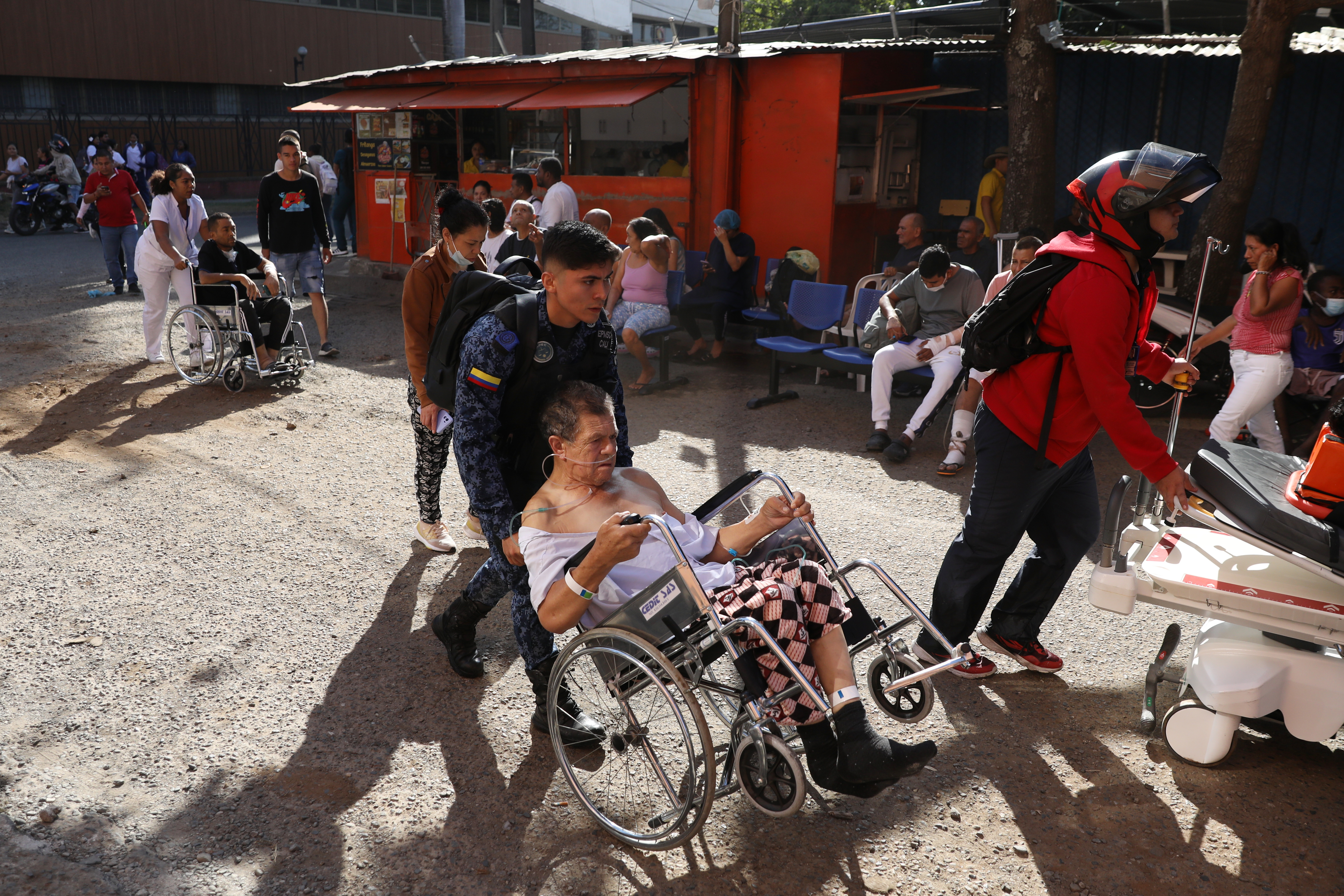 A police officer walks amid debris of a damaged commercial store after the earthquake in Manizales, Colombia, on August 10, 2026. A strong earthquake struck Colombia on August 10 and was strongly felt in major cities such as Bogota and Cali, and even in Quito and Panama, according to the Colombian Geological Service and as confirmed by AFP reporters. (Photo by Jonh Bonilla / AFP)