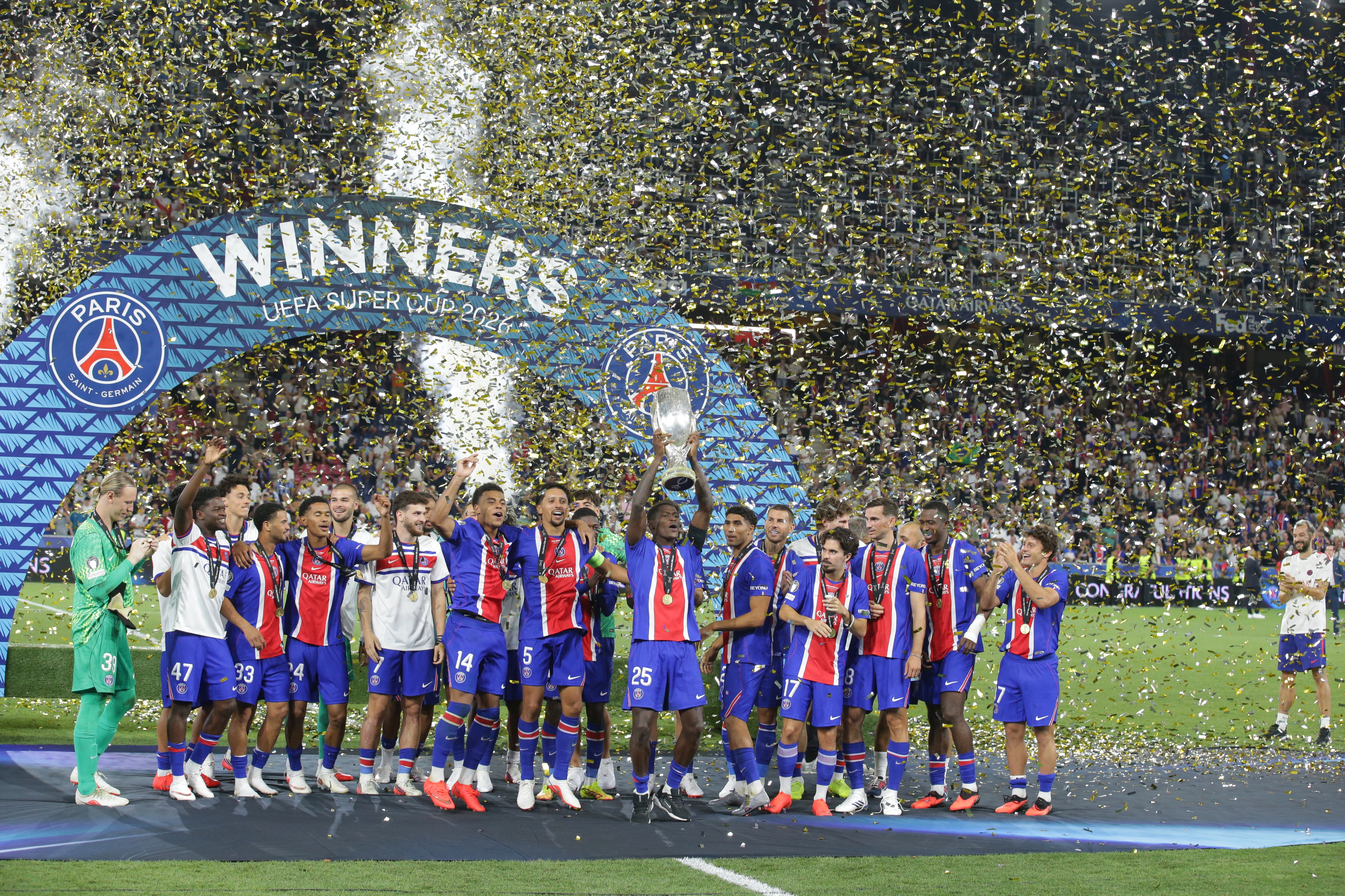 PSG's players lift the trophy during celebrations at the end of the UEFA Super Cup soccer match between Paris Saint-Germain and Aston Villa