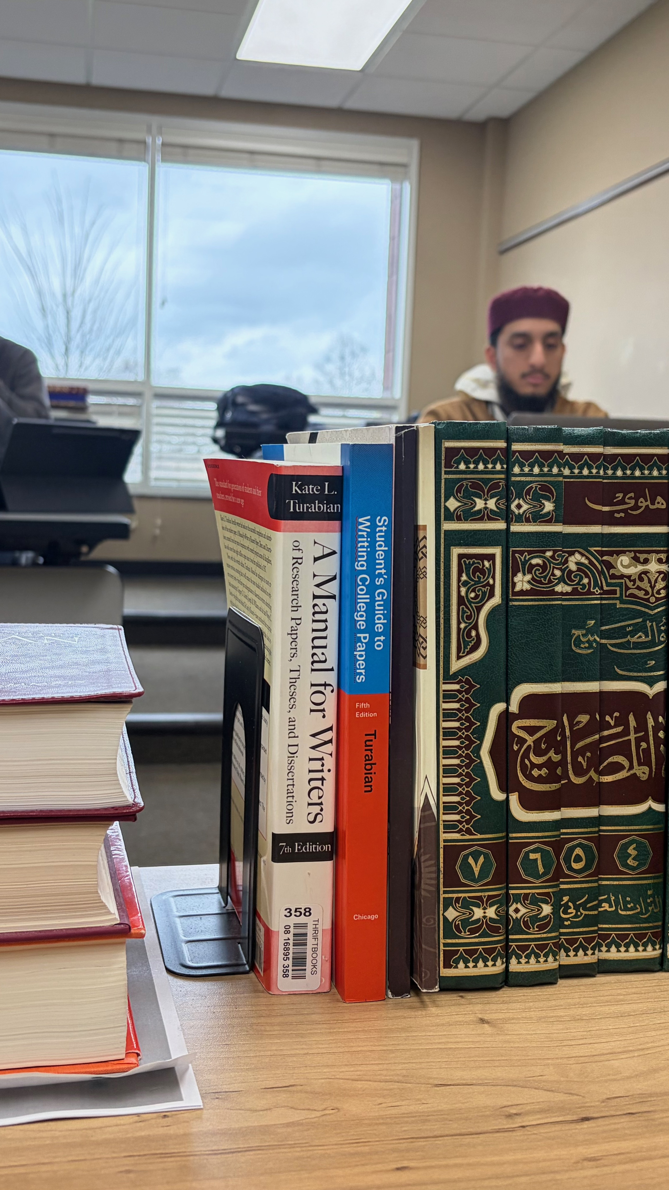 Books on Islamic law, theology and ethics sit on a desk at Darul Qasim, where a growing number of professionals are returning to classical scholarship