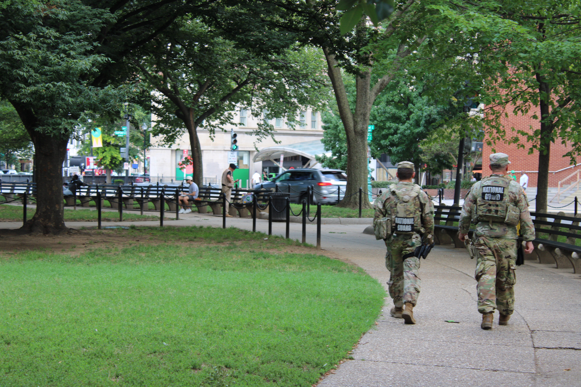 Two soldiers patrol the perimeter of Dupont Circle in downtown Washington, DC, on August 7