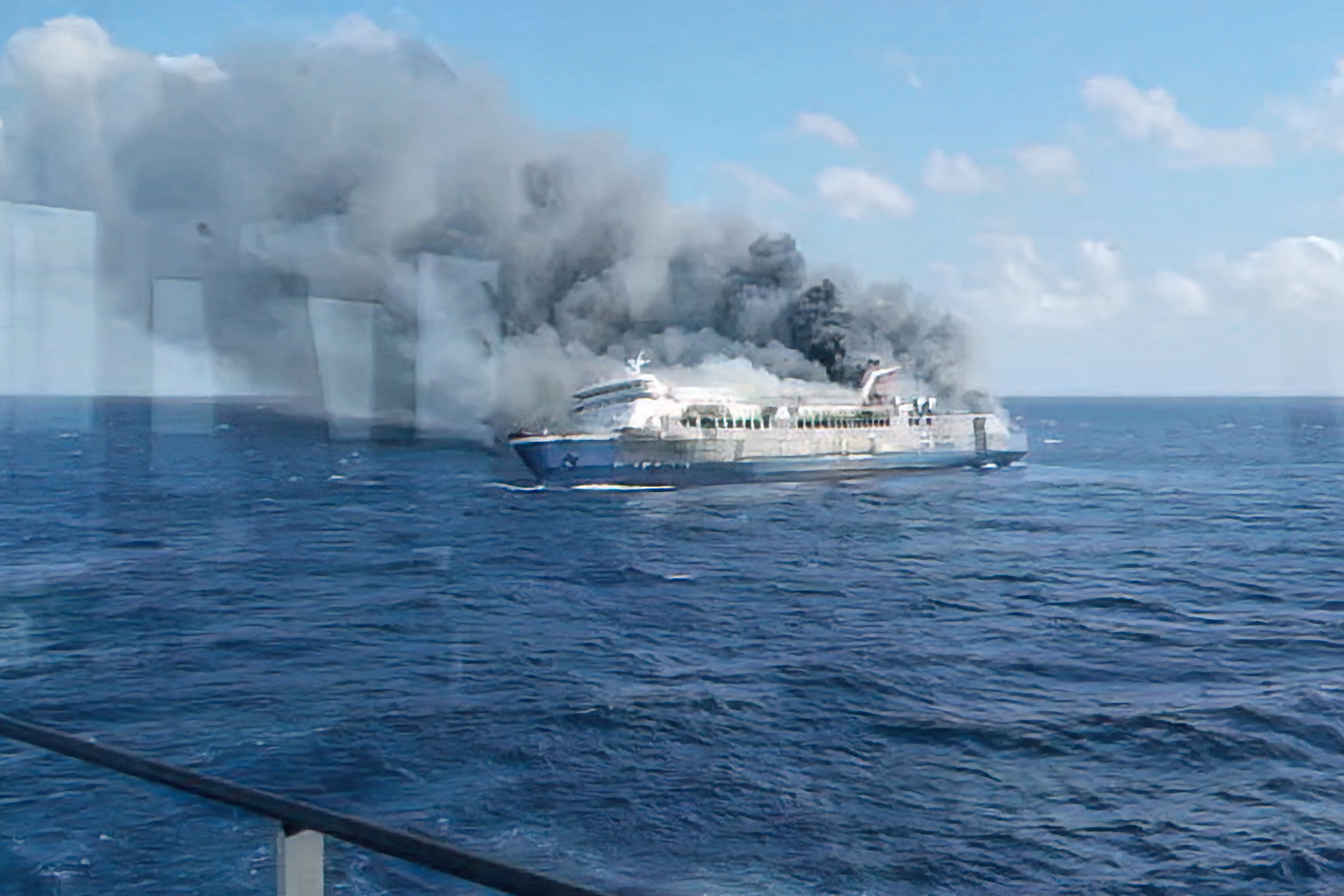 TOPSHOT - This screen grab from a handout video taken and released on August 2, 2026, by Indonesia's National Search and Rescue Agency (Basarnas), shows the passenger ship Mutiara Sentosa 2 catching fire in the waters off Madura island, East Java.