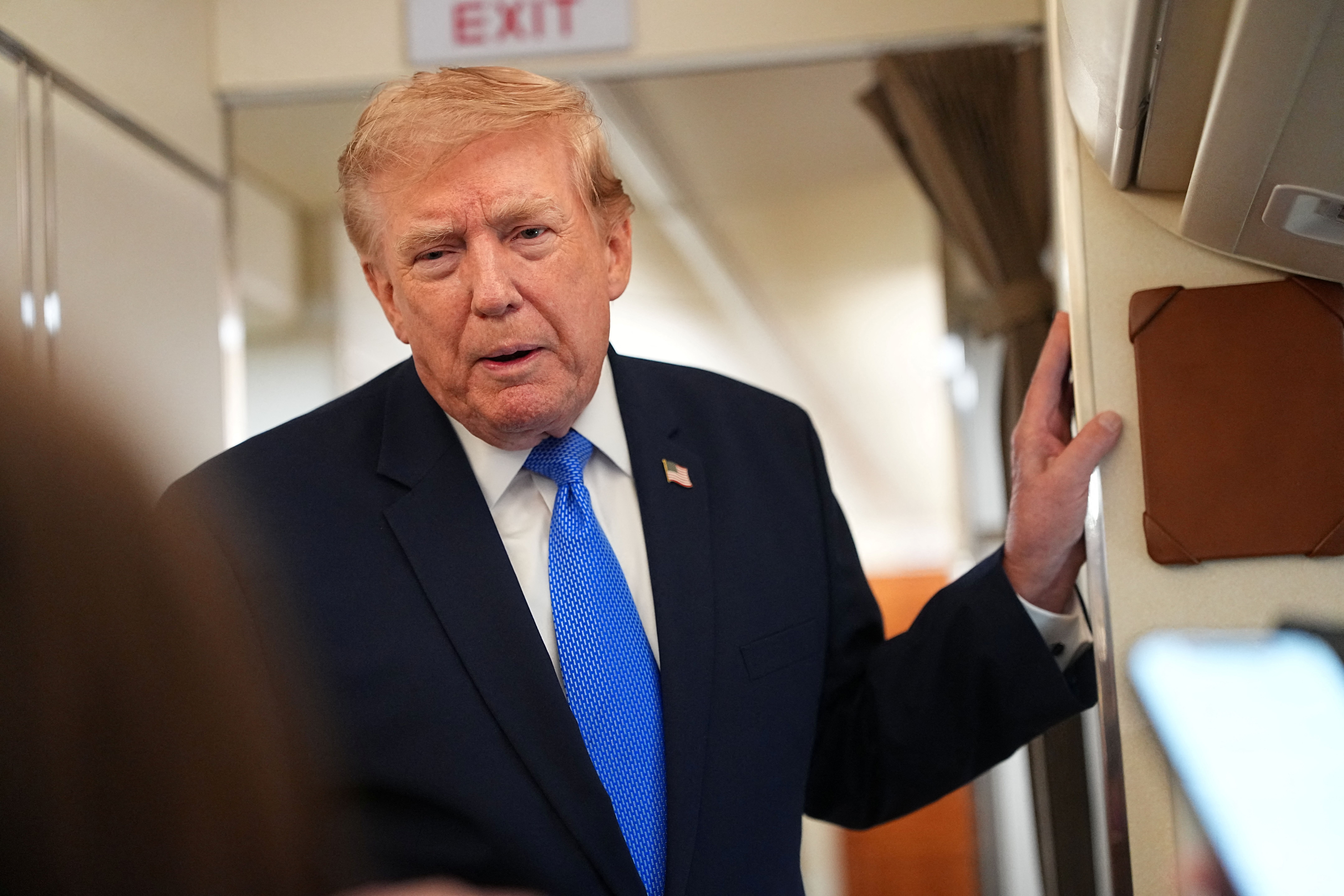 US President Donald Trump speaks to the press aboard Air Force One on August 2, 2026.