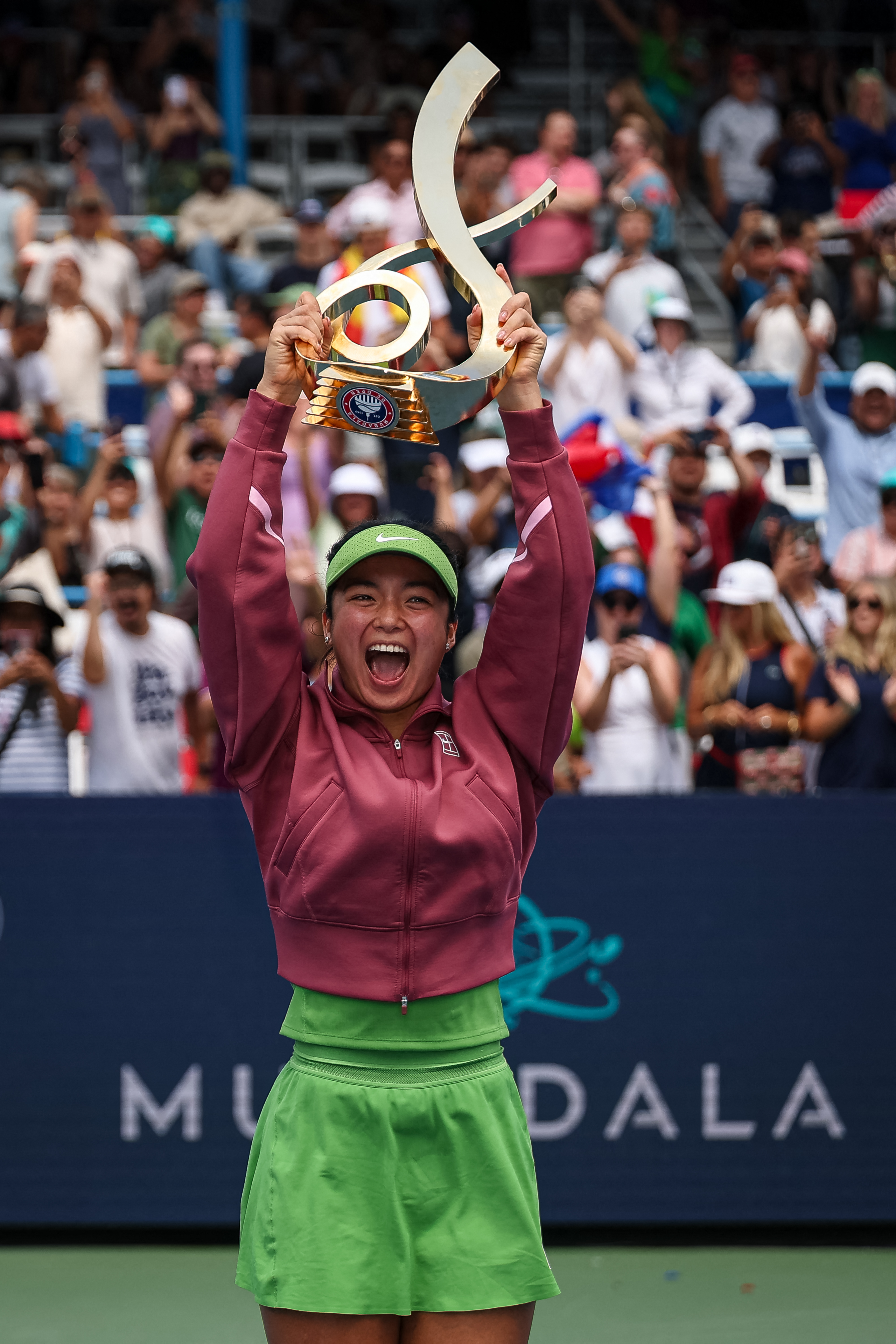 WASHINGTON, DC - AUGUST 03: Alexandra Eala of the Philippines celebrates with the Championship Trophy after winning the women's singles championship match against Jessica Pegula of the United States on the final day of the Mubadala DC Open 2026 at William H.G. FitzGerald Tennis Center on August 3, 2026 in Washington, DC. Scott Taetsch/Getty Images/AFP (Photo by Scott Taetsch / GETTY IMAGES NORTH AMERICA / Getty Images via AFP)