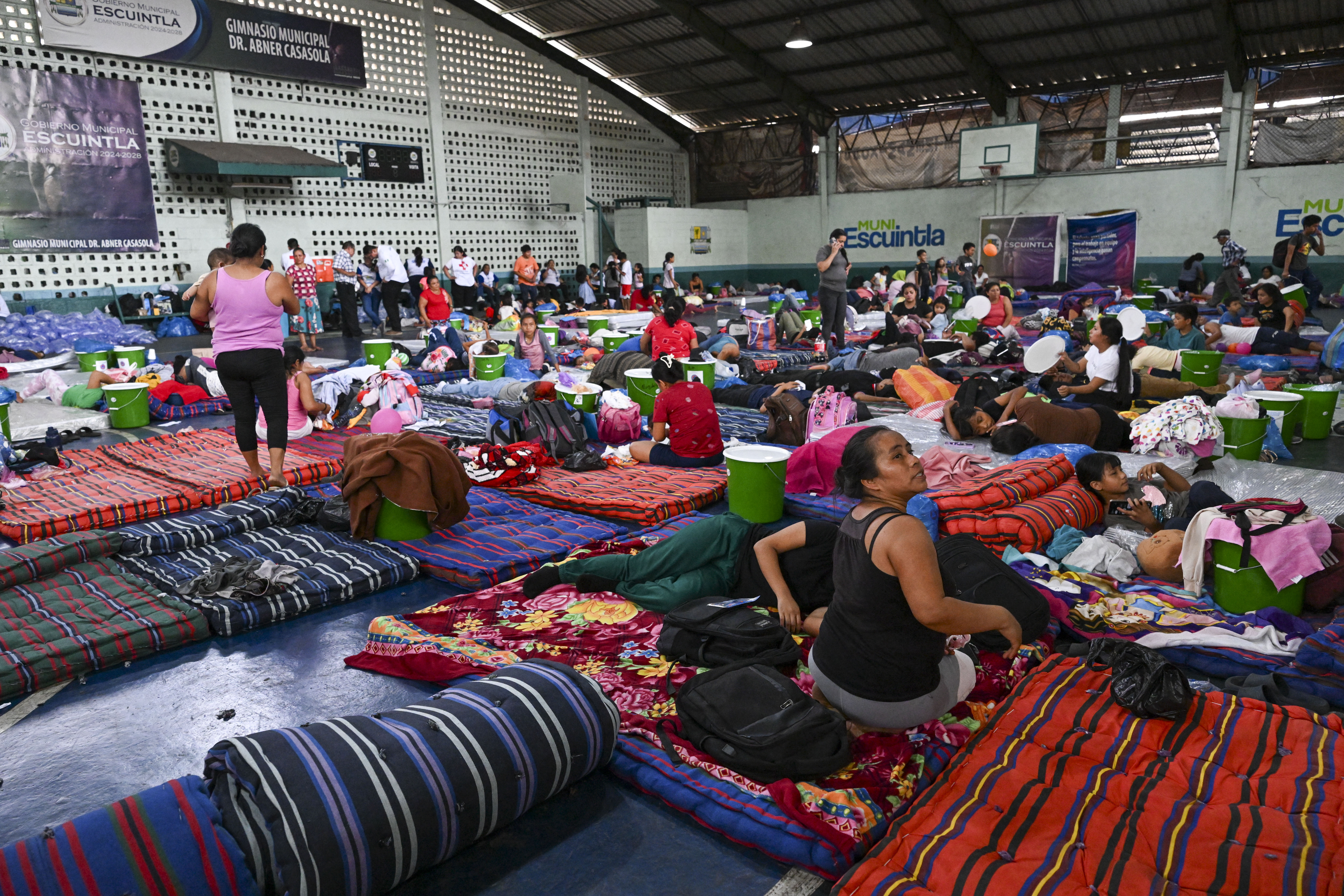 People resting on the floor in blankets