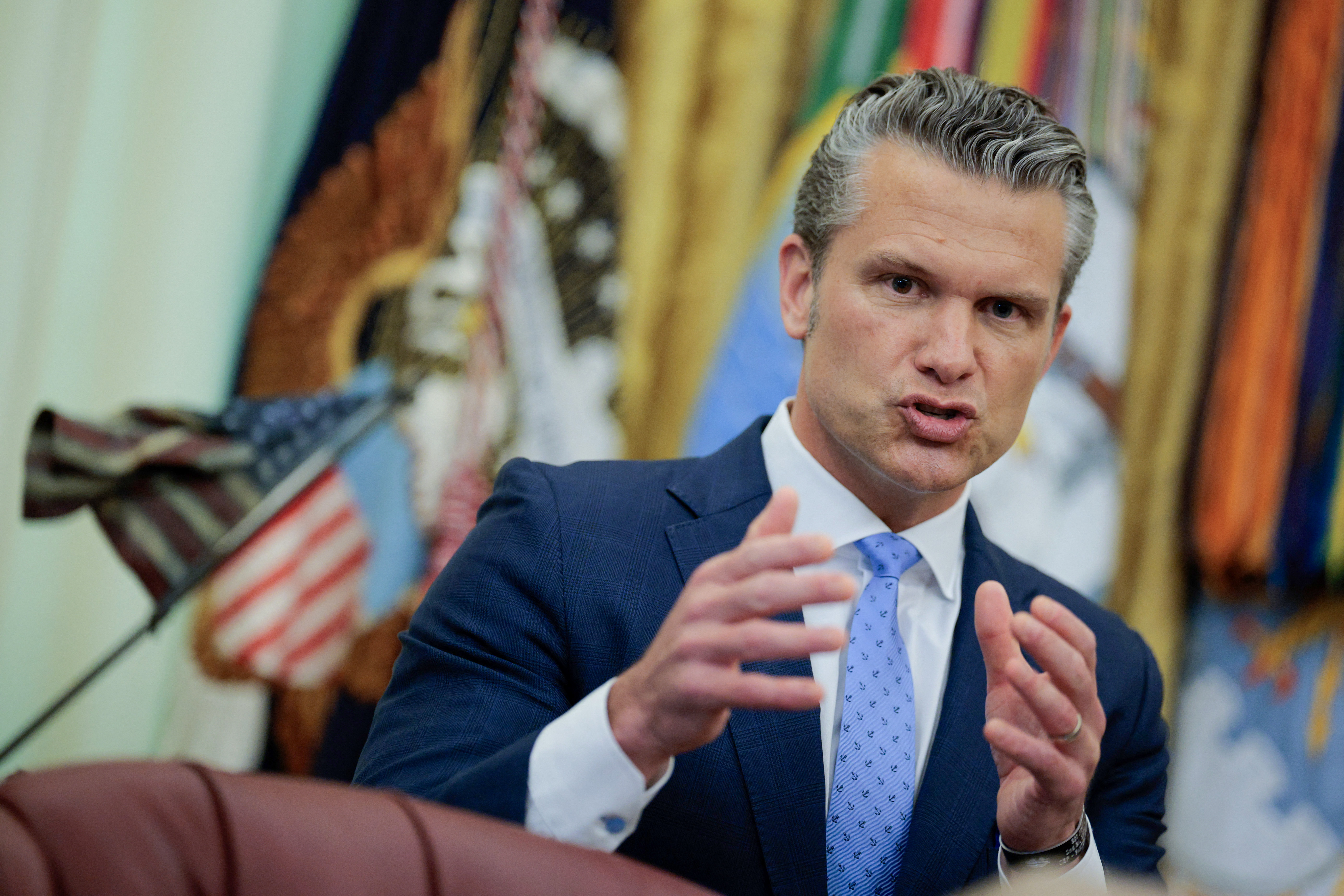 WASHINGTON, DC - AUGUST 03: U.S. Secretary of War Pete Hegseth speaks before U.S. President Donald Trump signs an executive order establishing the President's Military Spouse Commission in the Oval Office at the White House on August 03, 2026 in Washington, DC. The commission will advise the president about issues affecting military families and provide recommendations to improve quality of life and military readiness. Chip Somodevilla/Getty Images/AFP (Photo by CHIP SOMODEVILLA / GETTY IMAGES NORTH AMERICA / Getty Images via AFP)