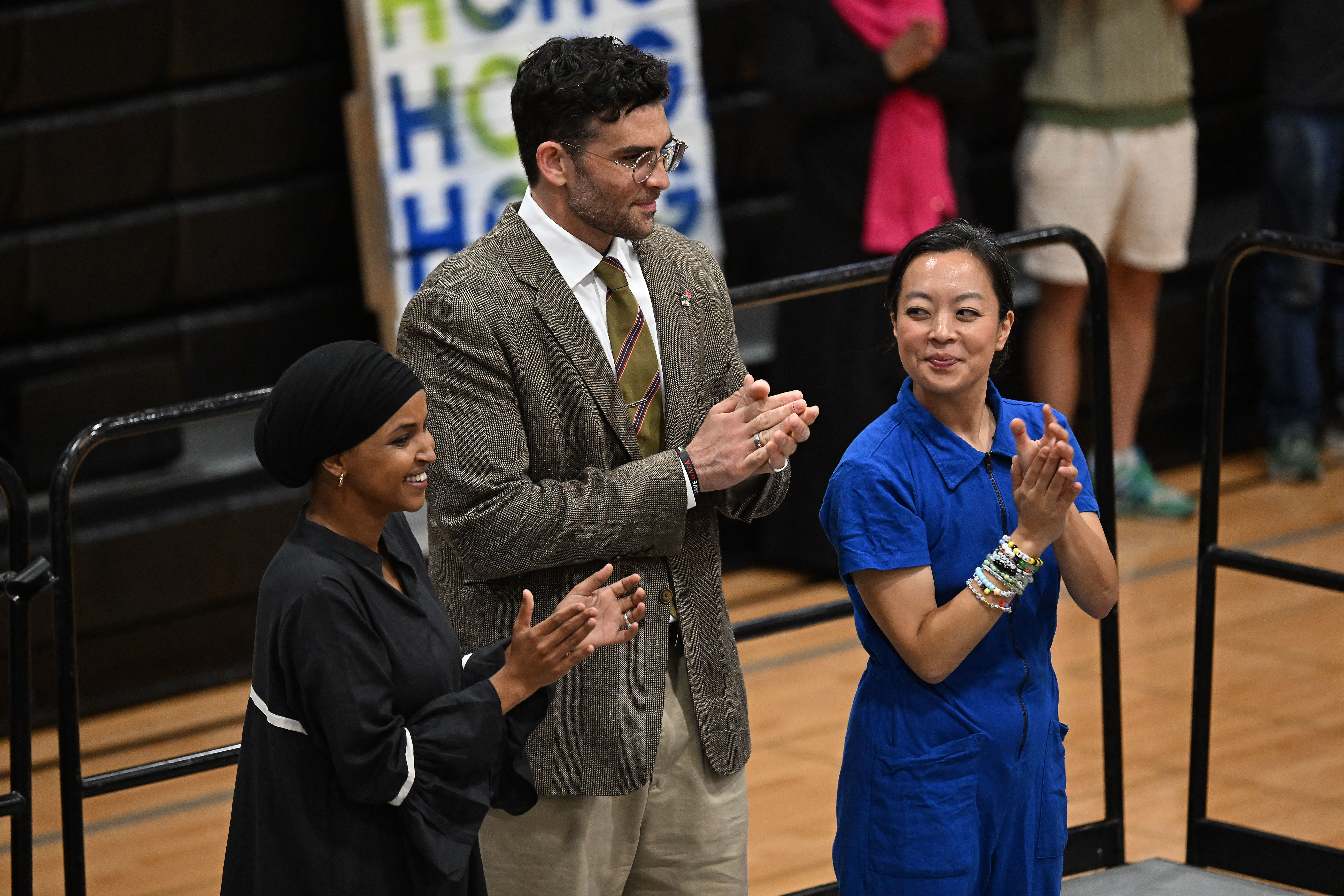 MILWAUKEE, WISCONSIN - AUGUST 2: Rep. Ilhan Omar (D-MN) (L) and influencer and left-wing political commentator Hasan Piker (C) stand with Wisconsin Gubernatorial candidate Francesca Hong during a campaign rally for Hong on August 2, 2026 in Milwaukee, Wisconsin. Hong, a democratic socialist in the state legislature, has seen an uptick in recent poll numbers. Joshua Lott/Getty Images/AFP (Photo by Joshua LOTT / GETTY IMAGES NORTH AMERICA / Getty Images via AFP)