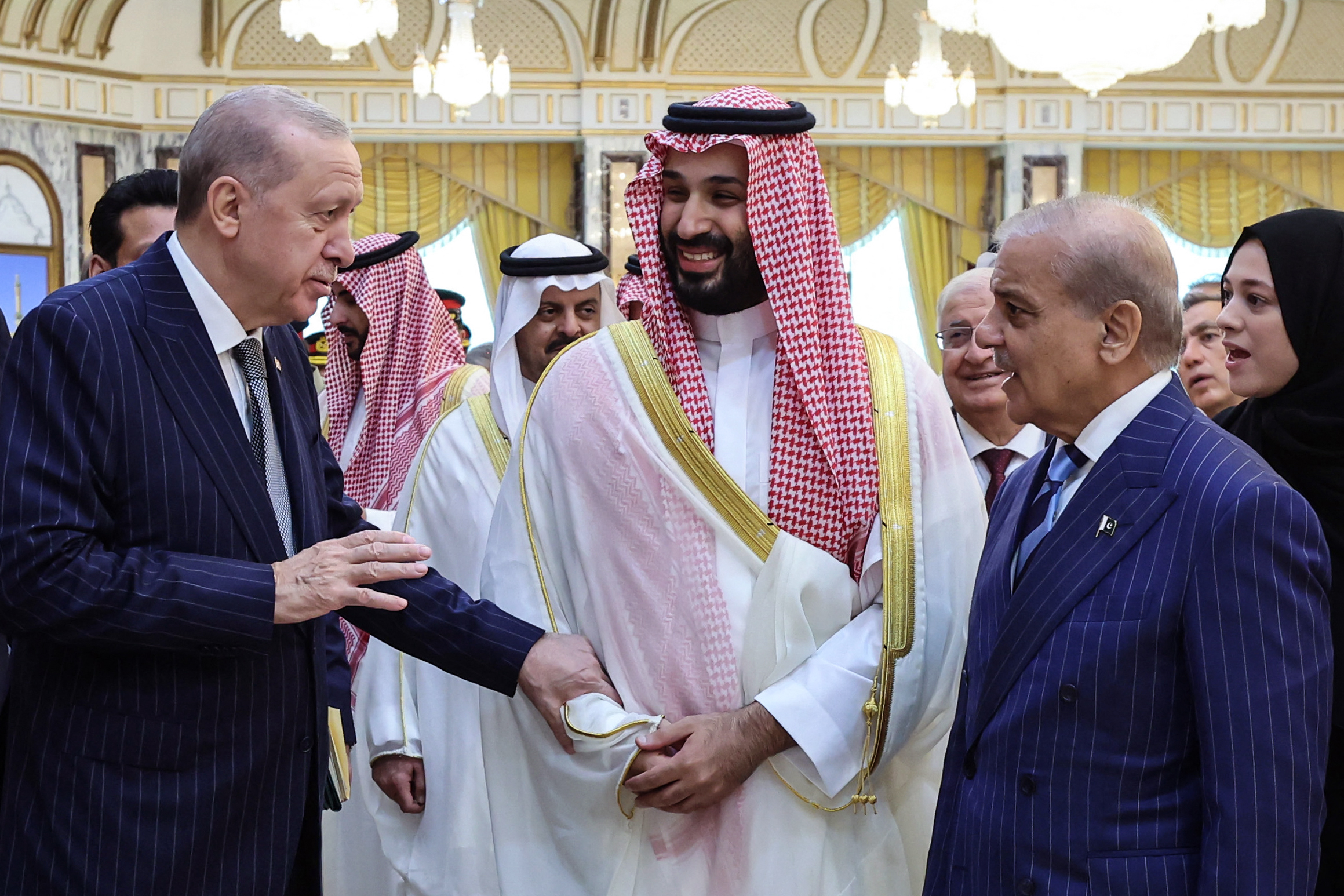 This handout photograph taken and released by the Turkish Presidency press office on August 7, 2026, shows Turkey's President Recep Tayyip Erdogan (L), Saudi Arabia's Crown Prince Mohammed bin Salman (C) and Pakistan’s Prime Minister Shehbaz Sharif meeting in Mecca.