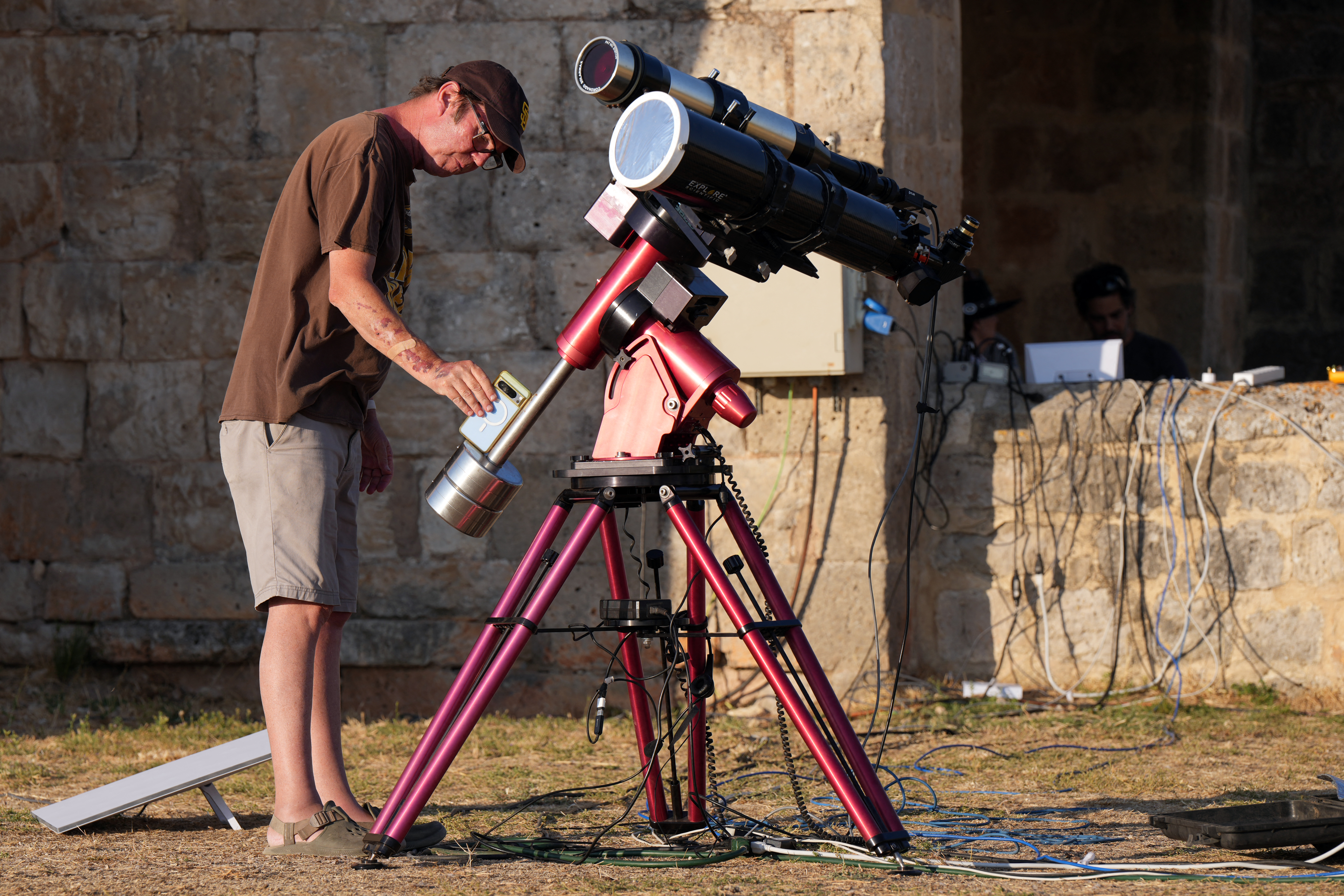 A researcher from San Francisco's Exploratorium museum carries out preparations for the global live broadcast of the upcoming August 12 total solar eclipse, in the abandoned village of Villalibado, near Burgos, northern Spain, on August 10, 2026.