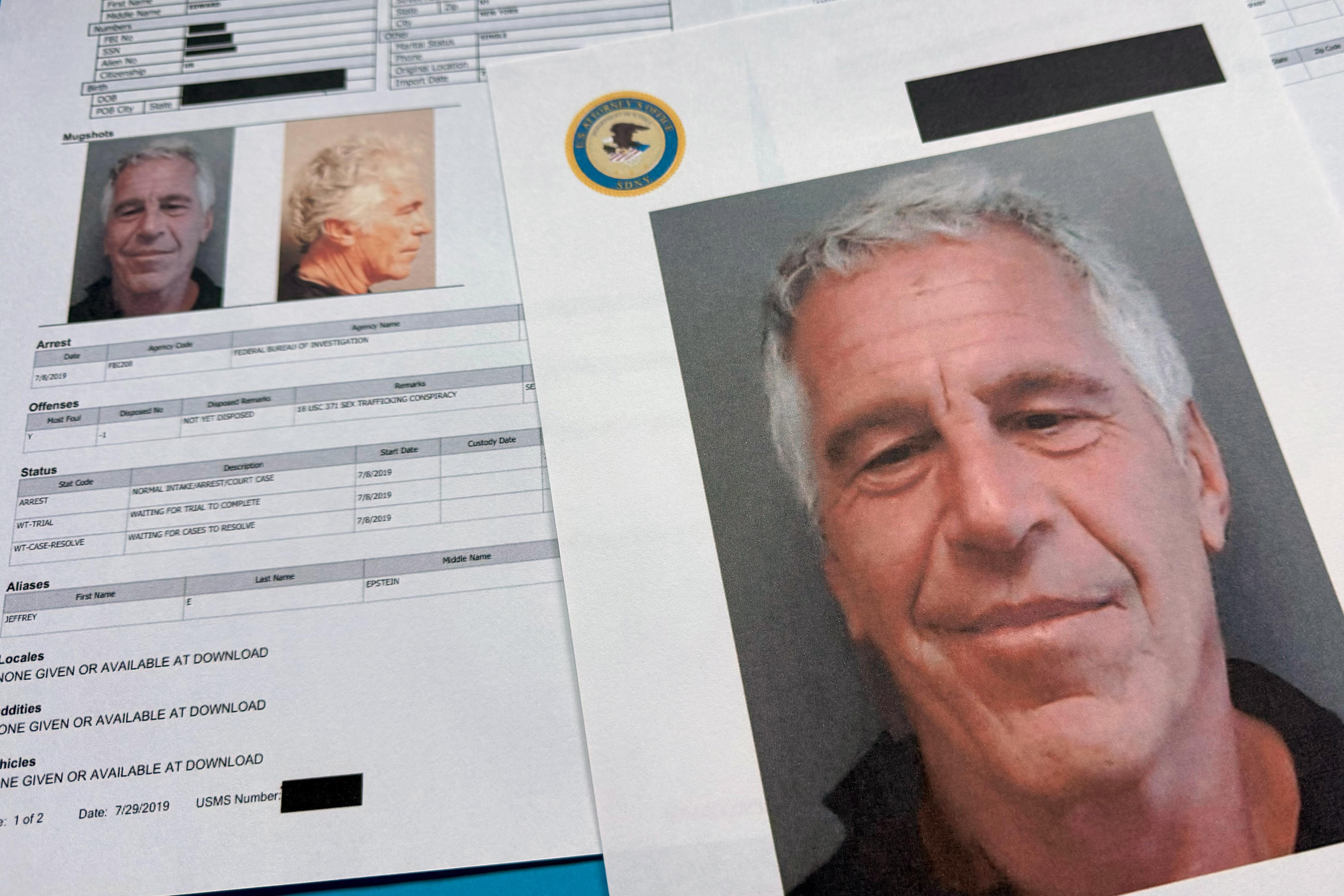 FILE - Documents that were included in the U.S. Department of Justice release of the Jeffrey Epstein files are photographed on Jan. 2, 2026. (AP Photo/Jon Elswick, File)