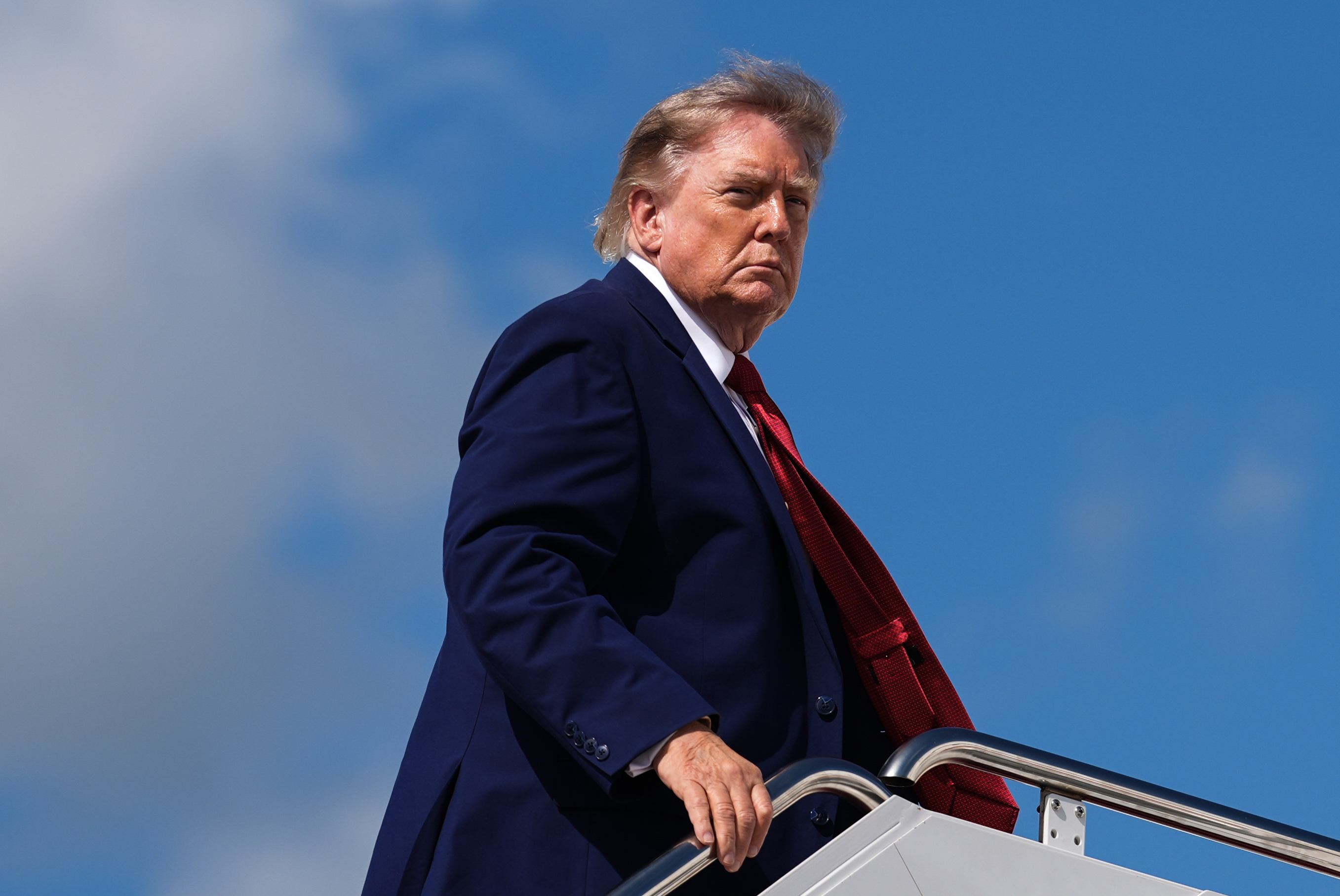 President Donald Trump boards Air Force One, Friday, Aug. 7, 2026, at Joint Base Andrews, Md. (AP Photo/Julia Demaree Nikhinson)