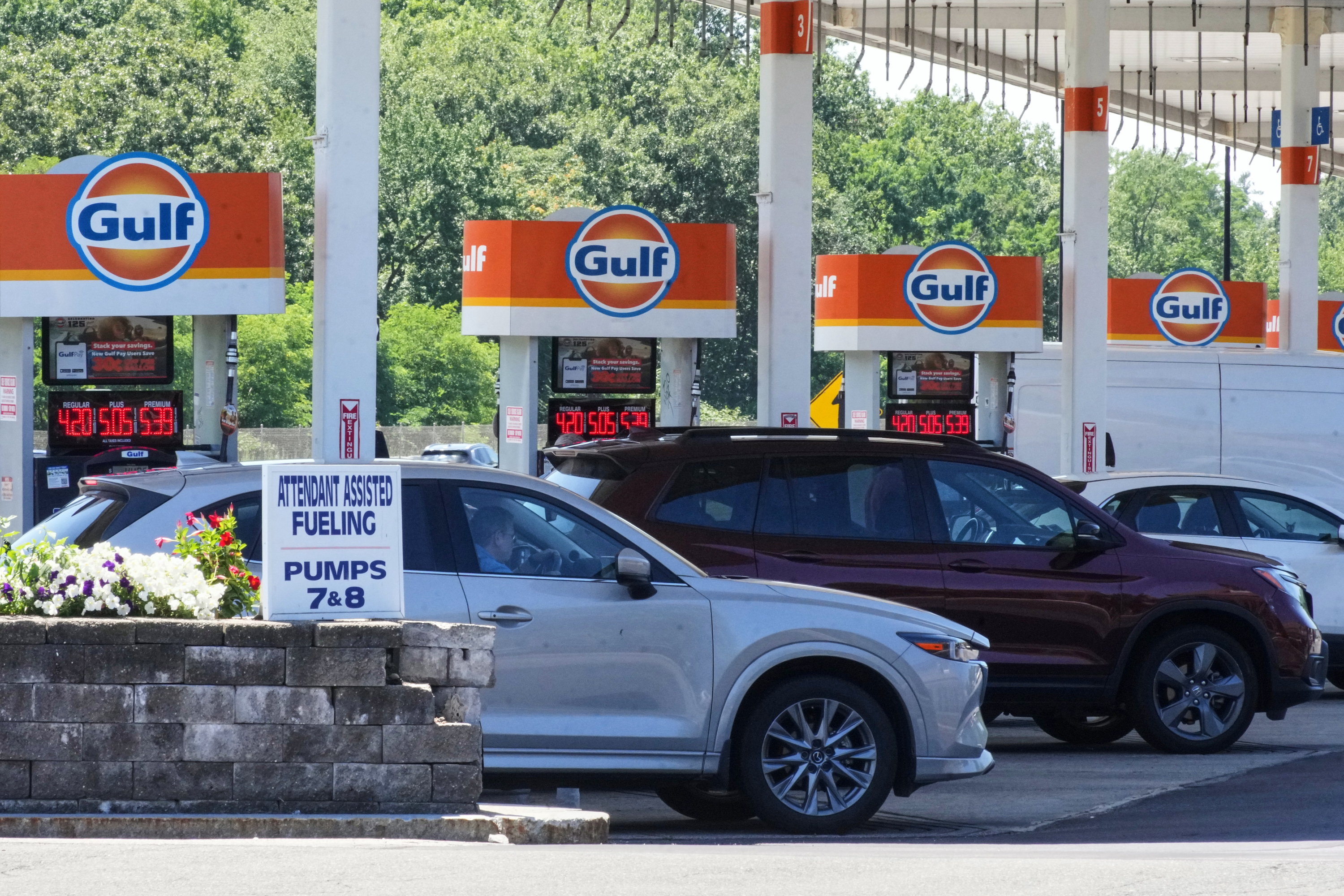 FILE - Cars line up at the pumps of a Gulf Oil station on the Massachusetts Turnpike near Boston, Sunday, July 19, 2026. (AP Photo/Gene J. Puskar, File)