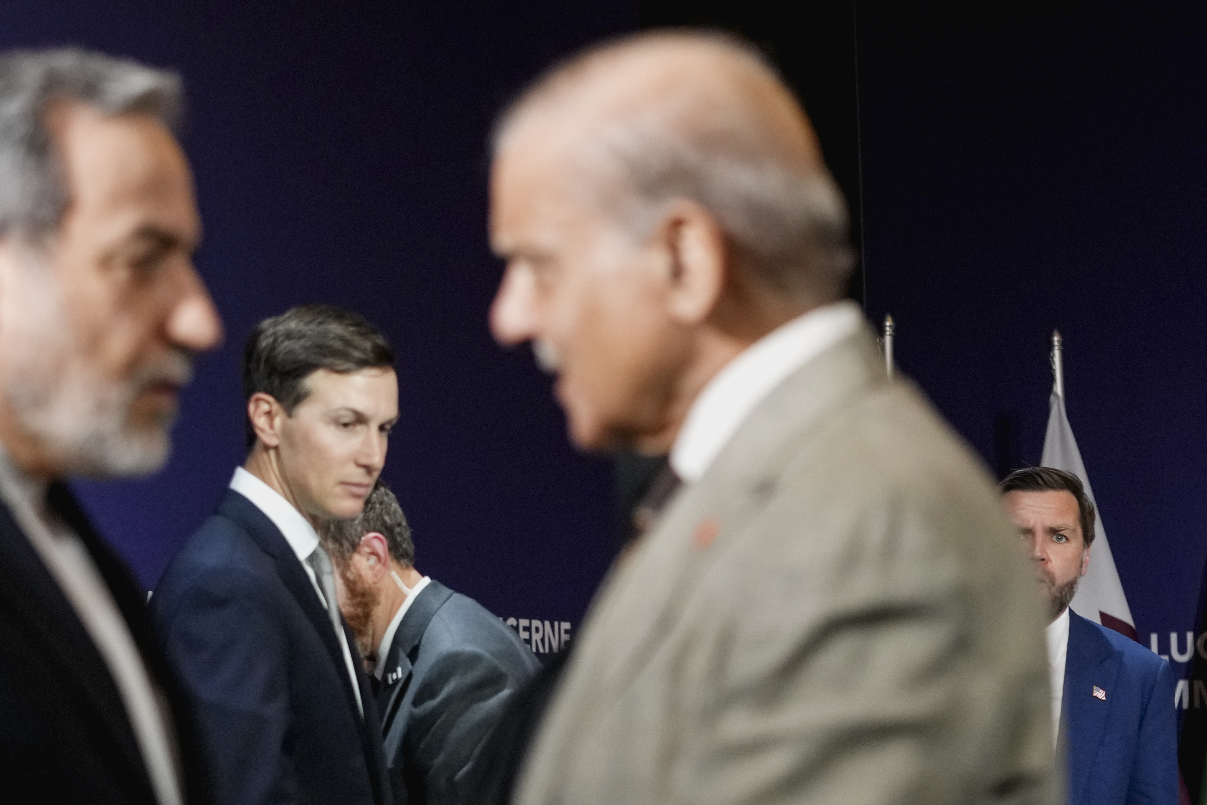 STANSSTAD, SWITZERLAND - JUNE 21: (EDITOR'S NOTE: Alternate crop) U.S. Vice President JD Vance (R) looks on next to U.S. President Donald Trump's son-in-law Jared Kushner, as Iran's Foreign Minister Abbas Araqchi (L) shakes hands with Pakistan's Prime Minister Shehbaz Sharif, before the start of a quadrilateral meeting between the U.S., Iran, Pakistan, and Qatar at the Lake Lucerne Summit, aimed at advancing a deal to end the Middle East conflict at the Buergenstock Resort, Lake Lucerne on June 21, 2026 near Stansstad, Switzerland. Vance is visiting Switzerland for negotiations with Iran to end the war and open the Strait of Hormuz that have been delayed by Israeli strikes in Lebanon. (Photo by Nathan Howard-Pool/Getty Images)