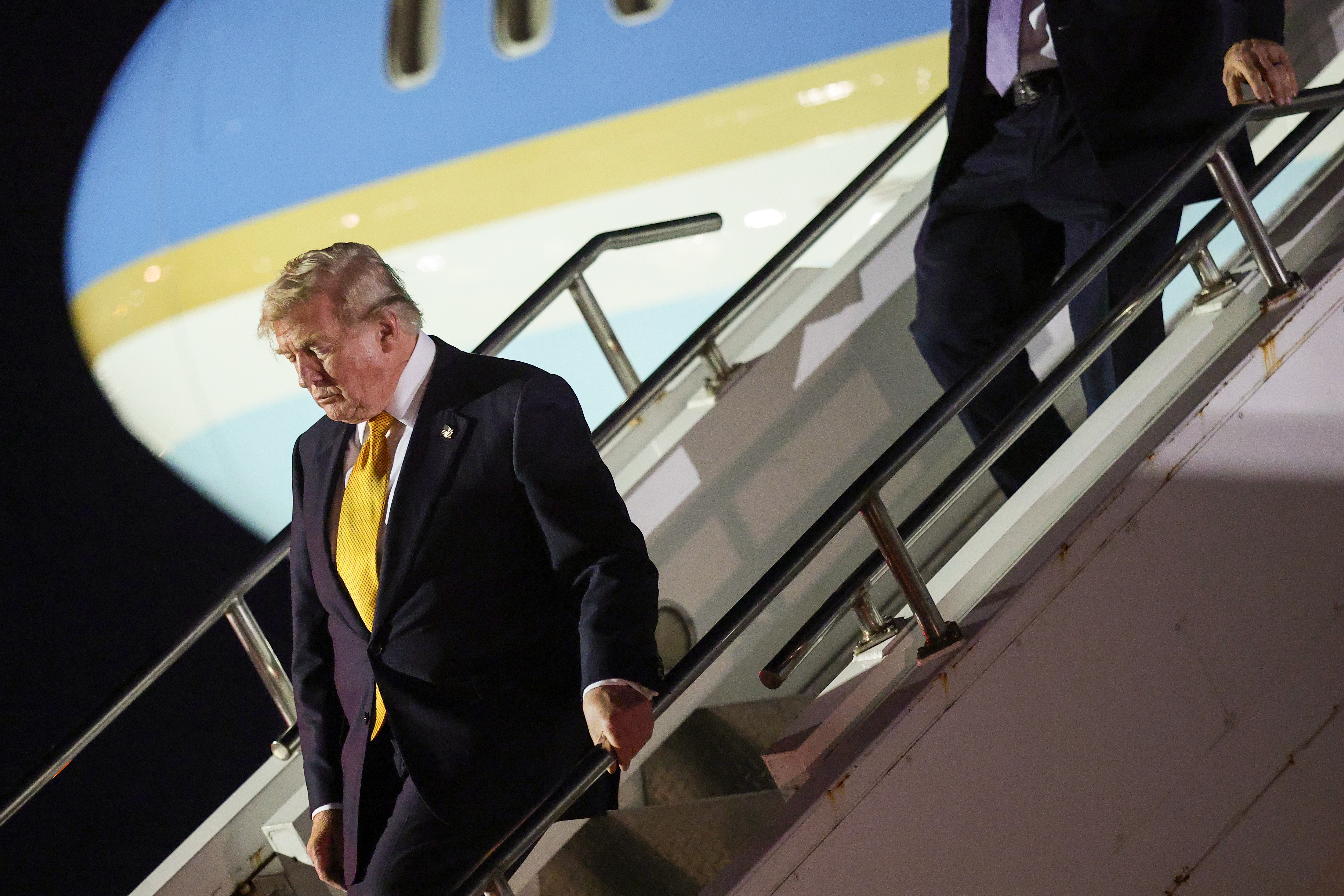 President Donald Trump steps off Air Force One