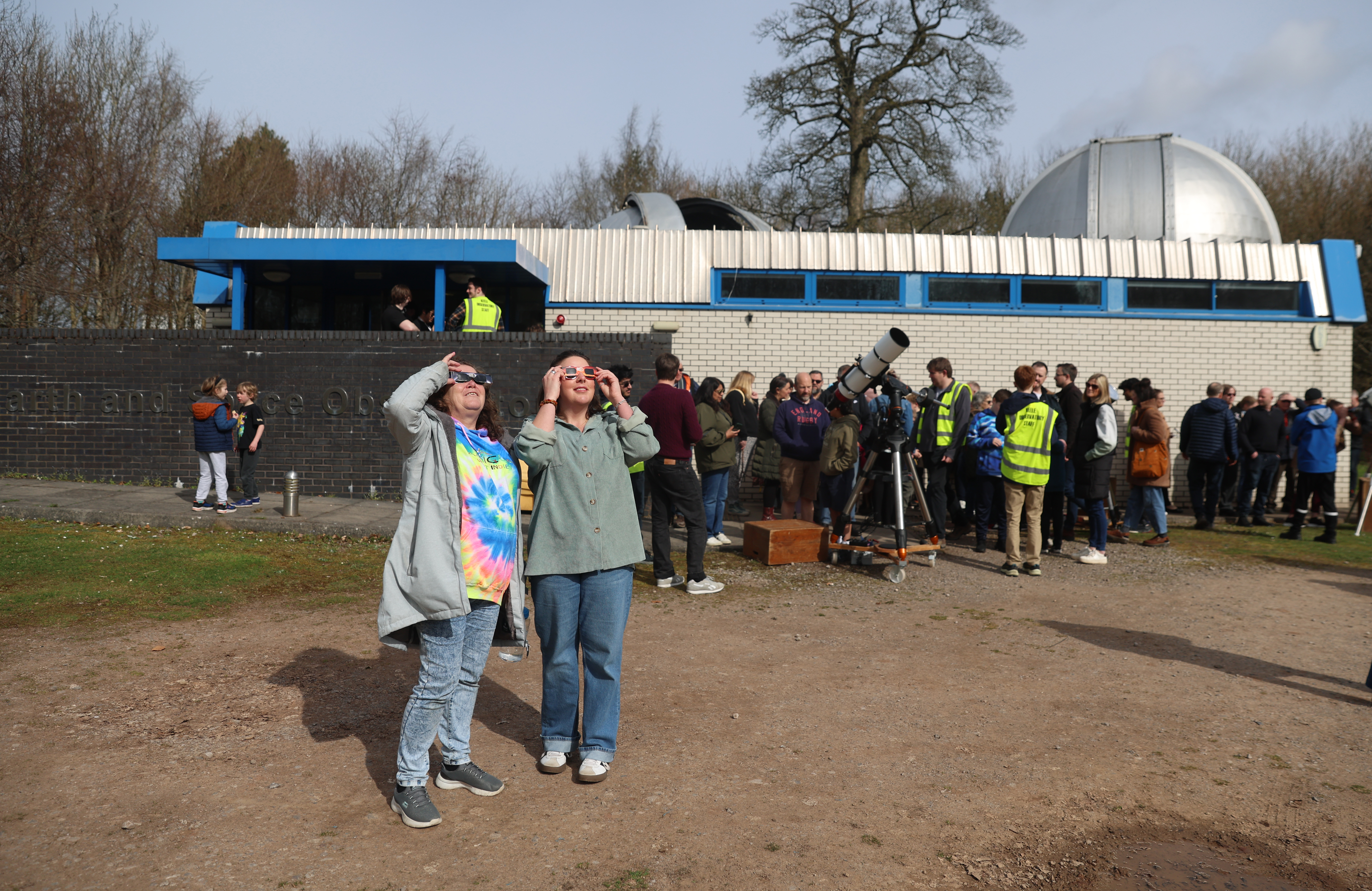 KEELE, STAFFORDSHIRE - MARCH 29: People watch a partial solar eclipse at the Keele Observatory on March 29, 2025 in Keele, Staffordshire. (Photo by Nathan Stirk/Getty Images)
