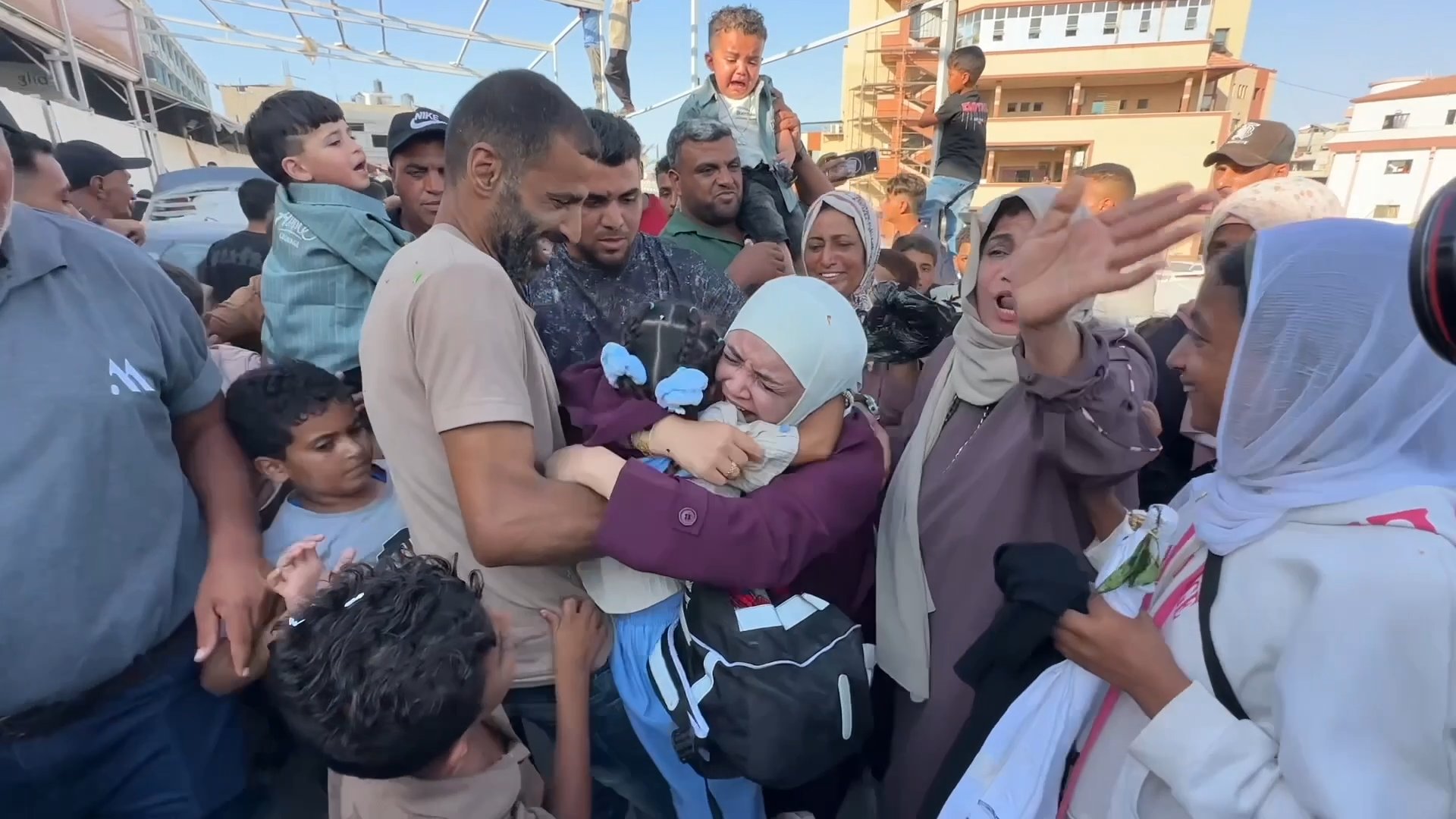 A woman embraces her daughter in Gaza after returning from seeking medical treatment outside the enclave. Khan Yunis, Gaza Strip, August 3, 2026 [Screenshot from Anadolu Agency]