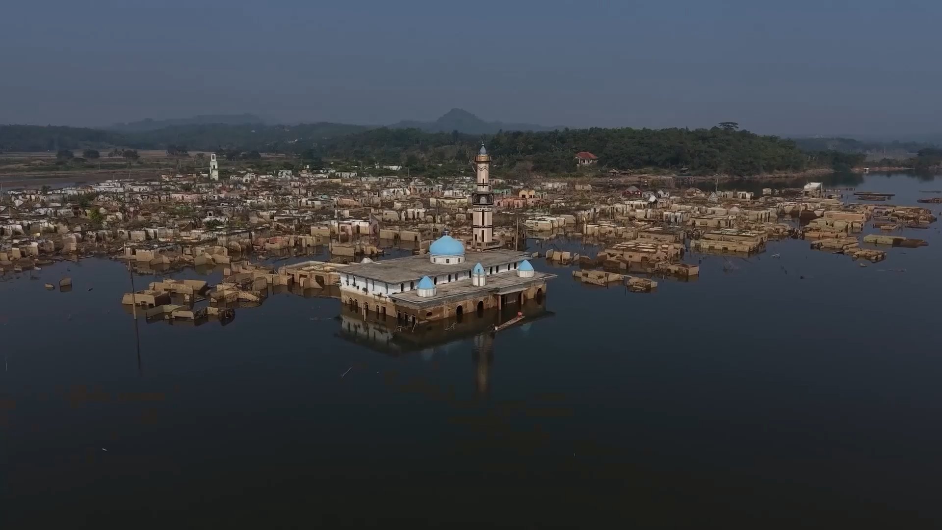 Receded water levels around Karian Reservoir due to drought captured by drone. Lebak Regency, Indonesia August 7, 2026 [Screenshot from Viory file]