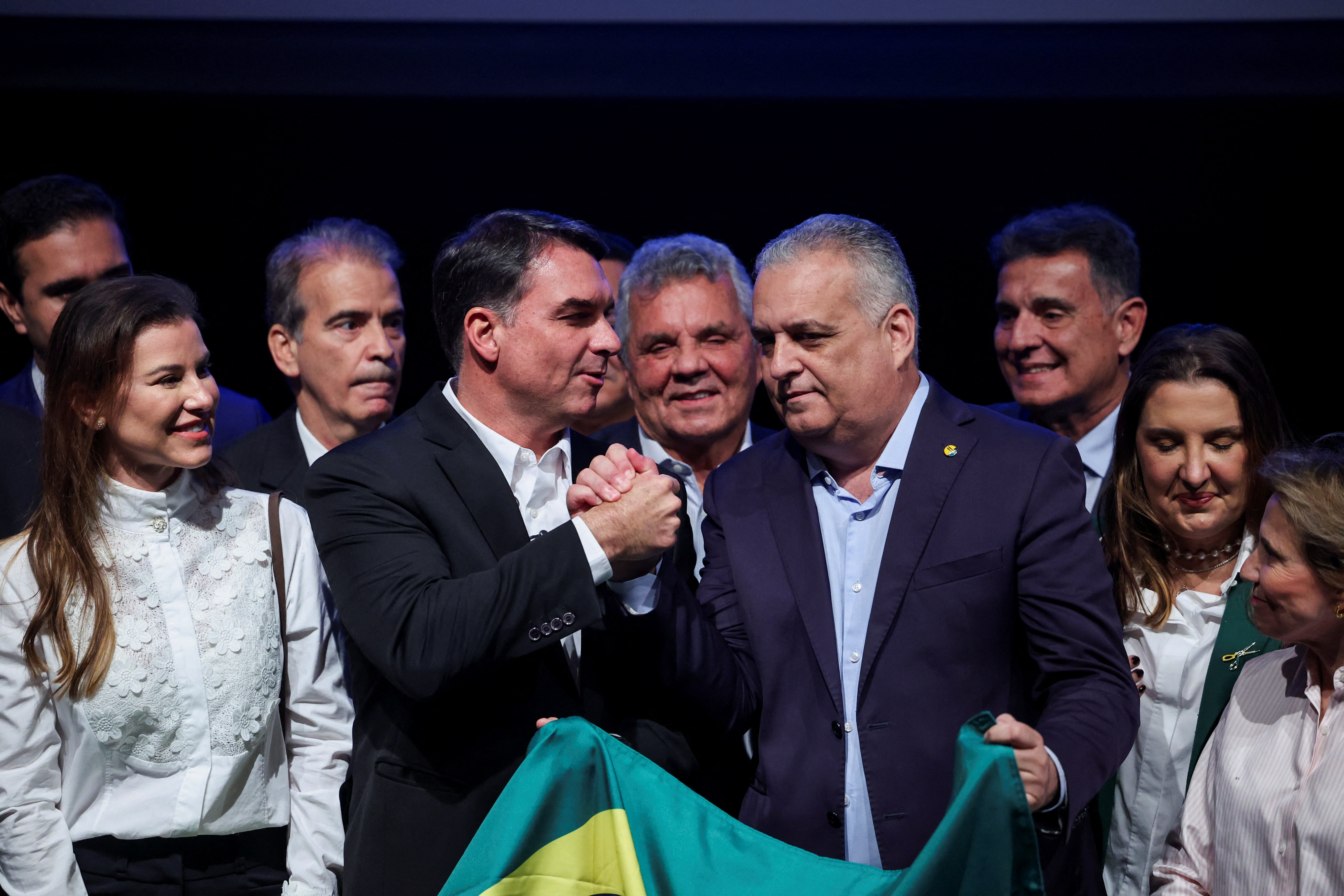 Senator Flavio Bolsonaro, the Liberal Party (PL) candidate in Brazil's presidential election, shakes hands with Alfredo Gaspar, during an event announcing Gaspar as Bolsonaro's vice-presidential running mate, in Brasilia, Brazil, August 5, 2026. REUTERS/Adriano Machado
